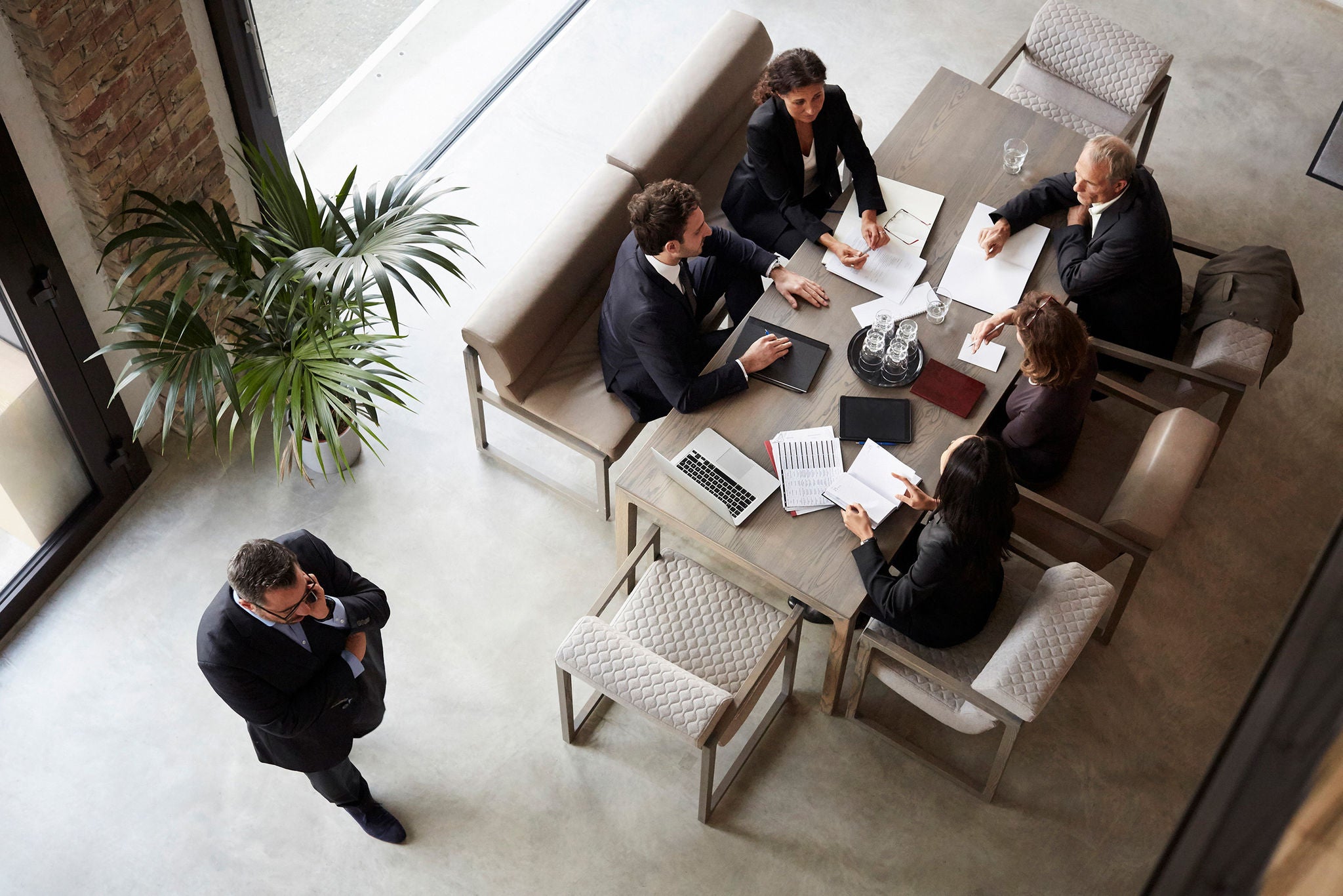 Team of financial advisors planning with business coworkers during meeting at law firm