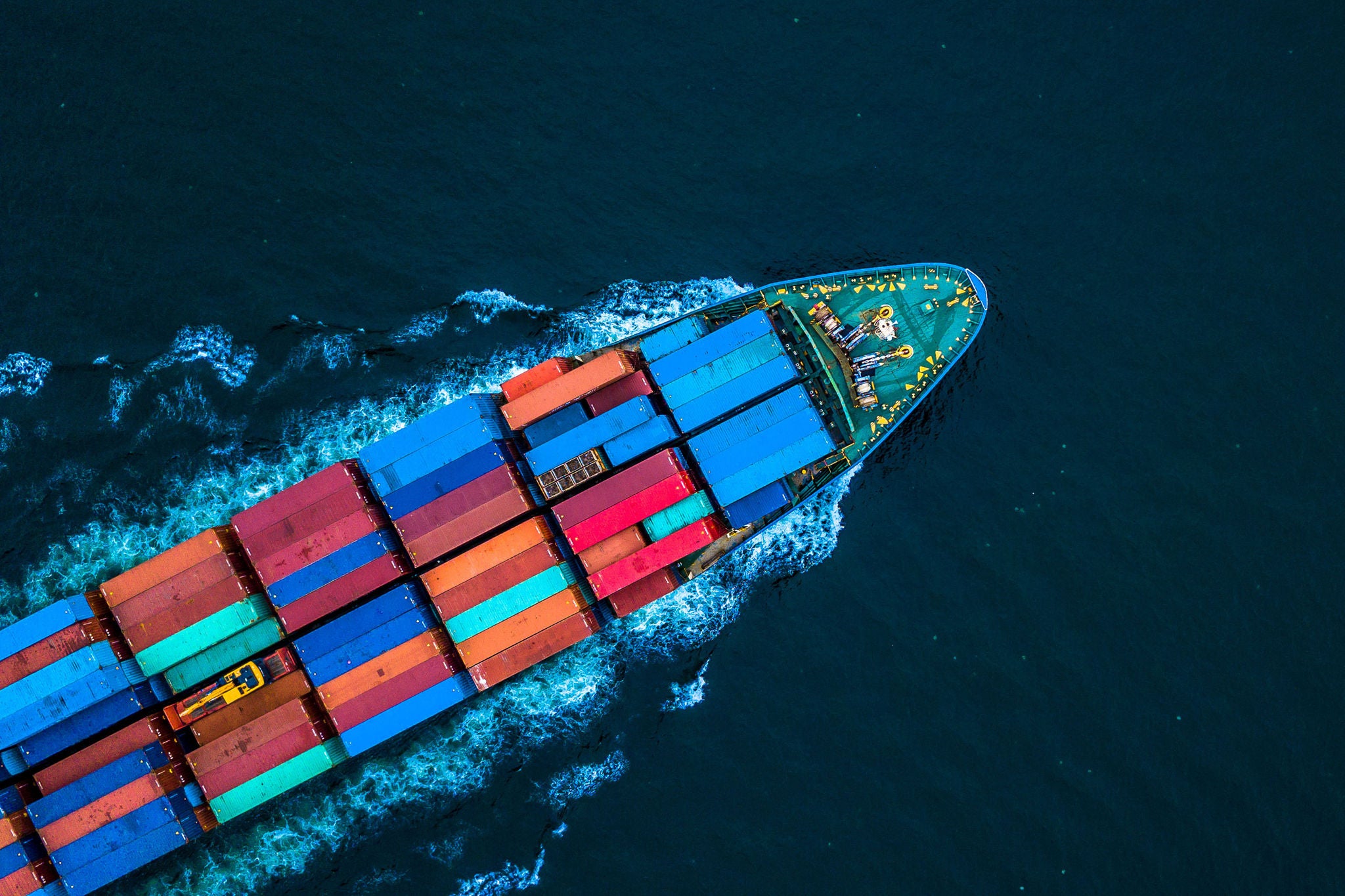 Aerial view from drone, Container ship or cargo shipping business logistic import and export freight transportation by container ship in open sea, Container loading cargo freight ship boat.