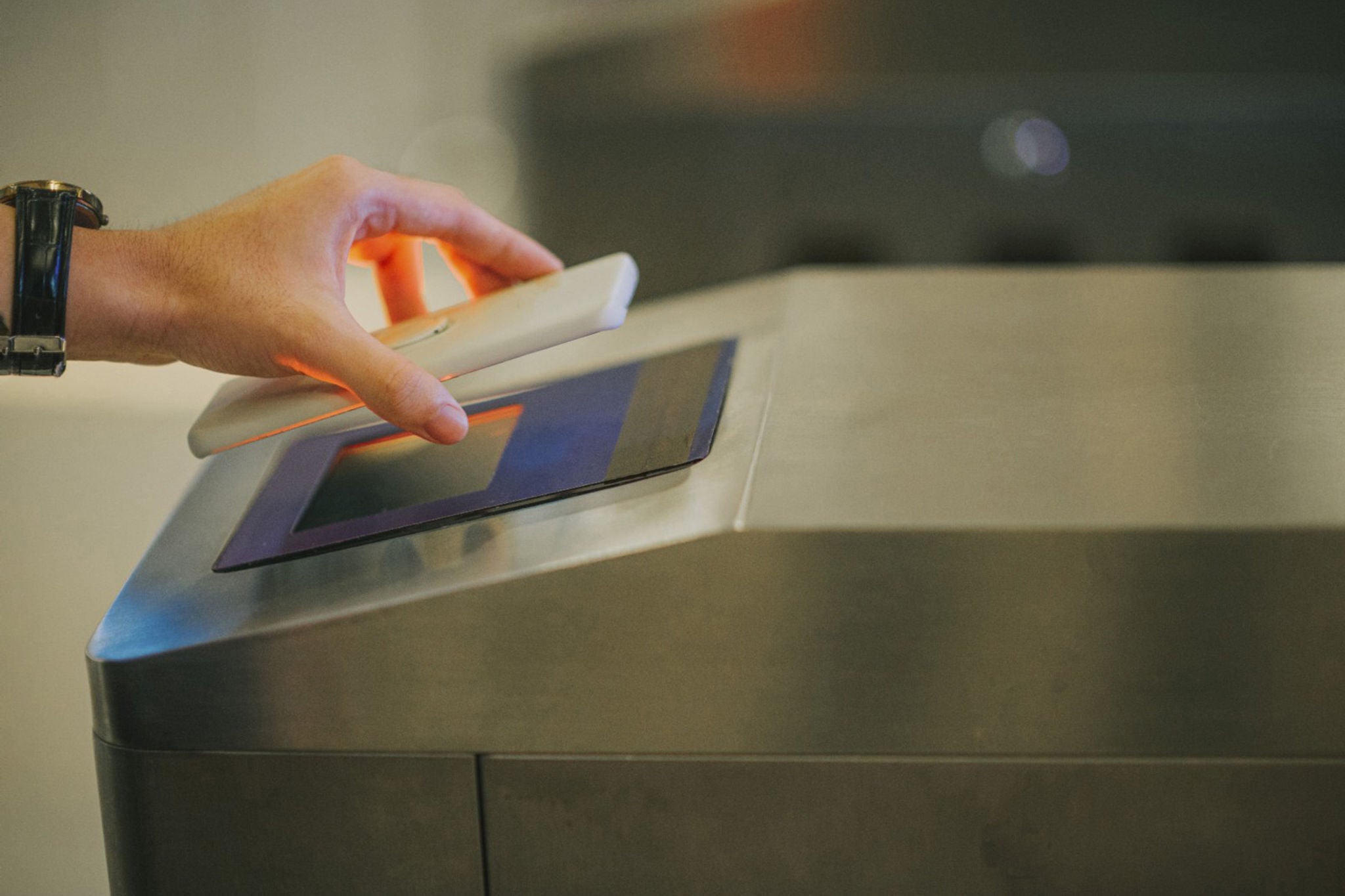e-ticketing man hand using smart phone mobile app barcode scanner