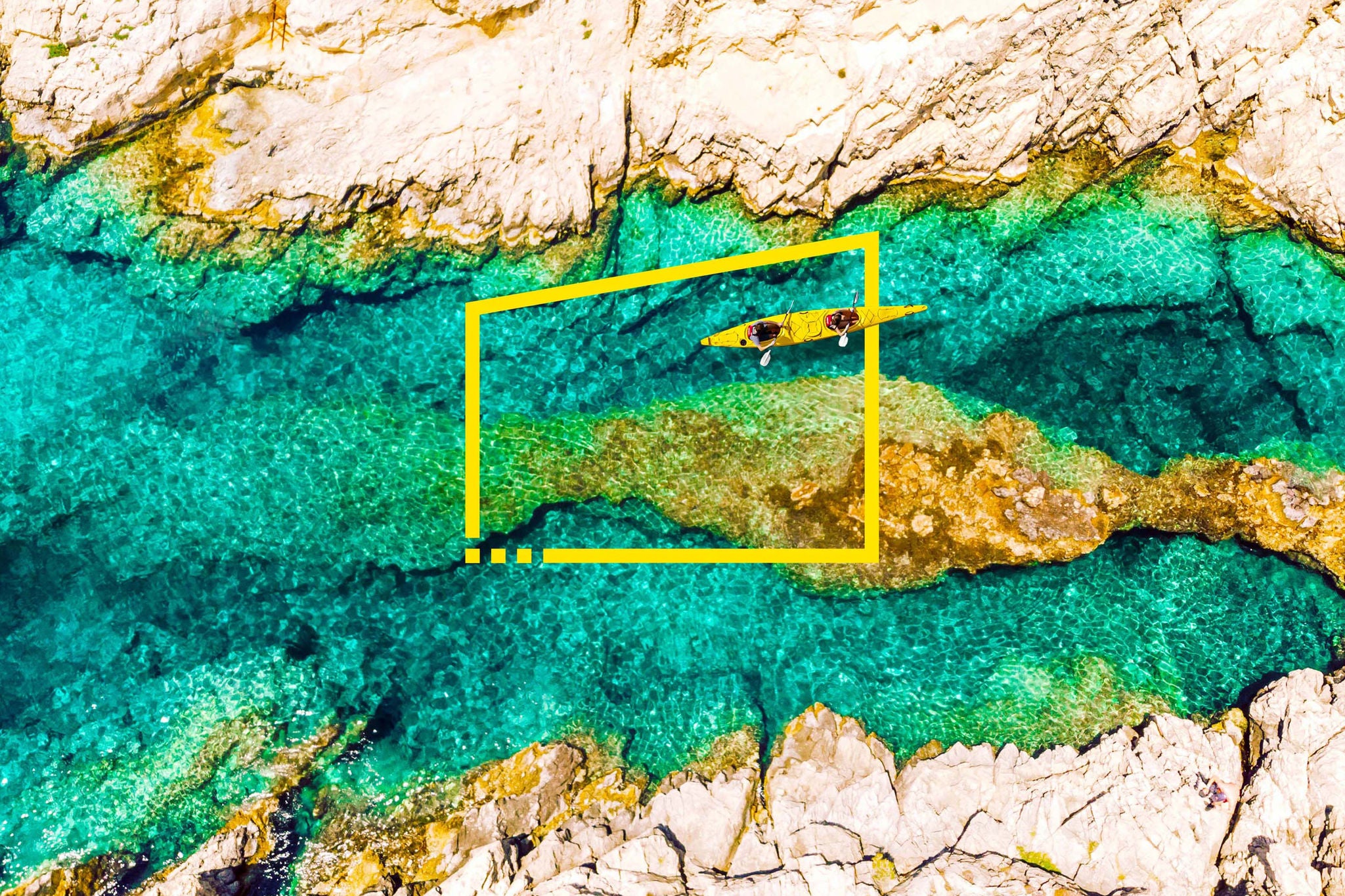 Directly above view of tandem kayak in transparent waters in greece background