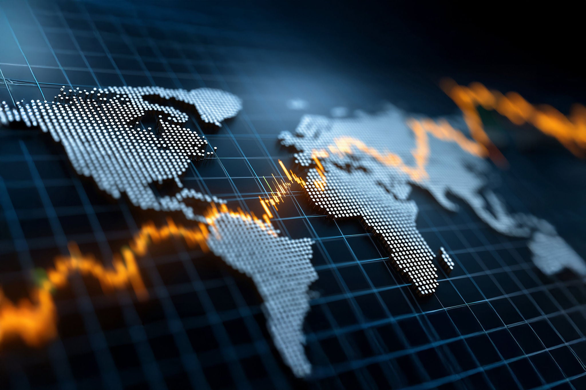 Man working on laptop while sitting in kitchen at home