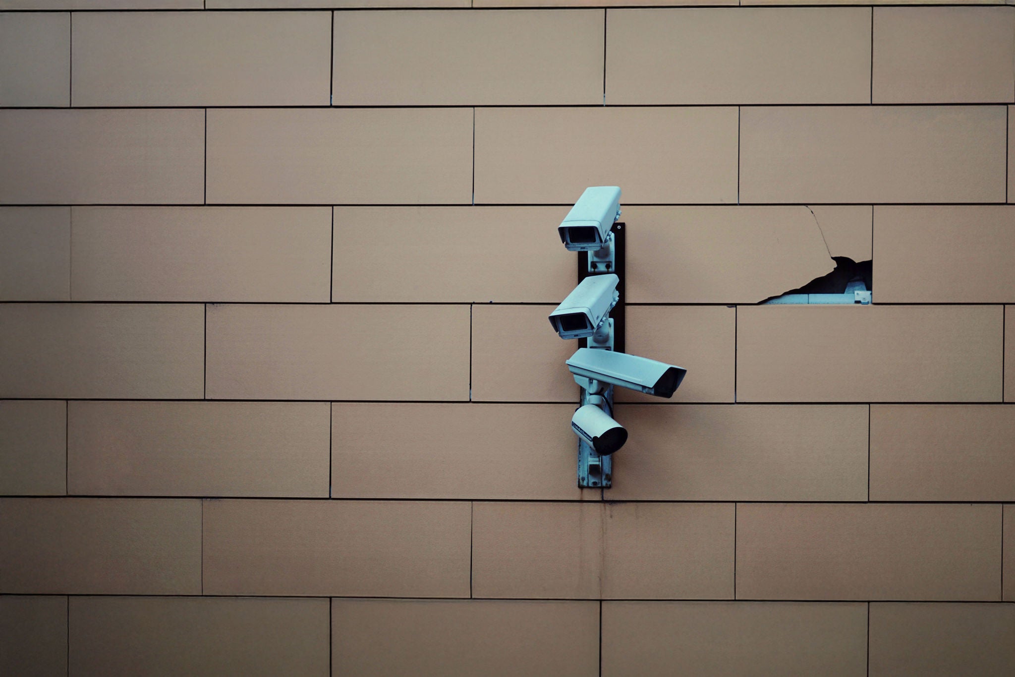 FULL FRAME SHOT OF CAMERA ON WALL