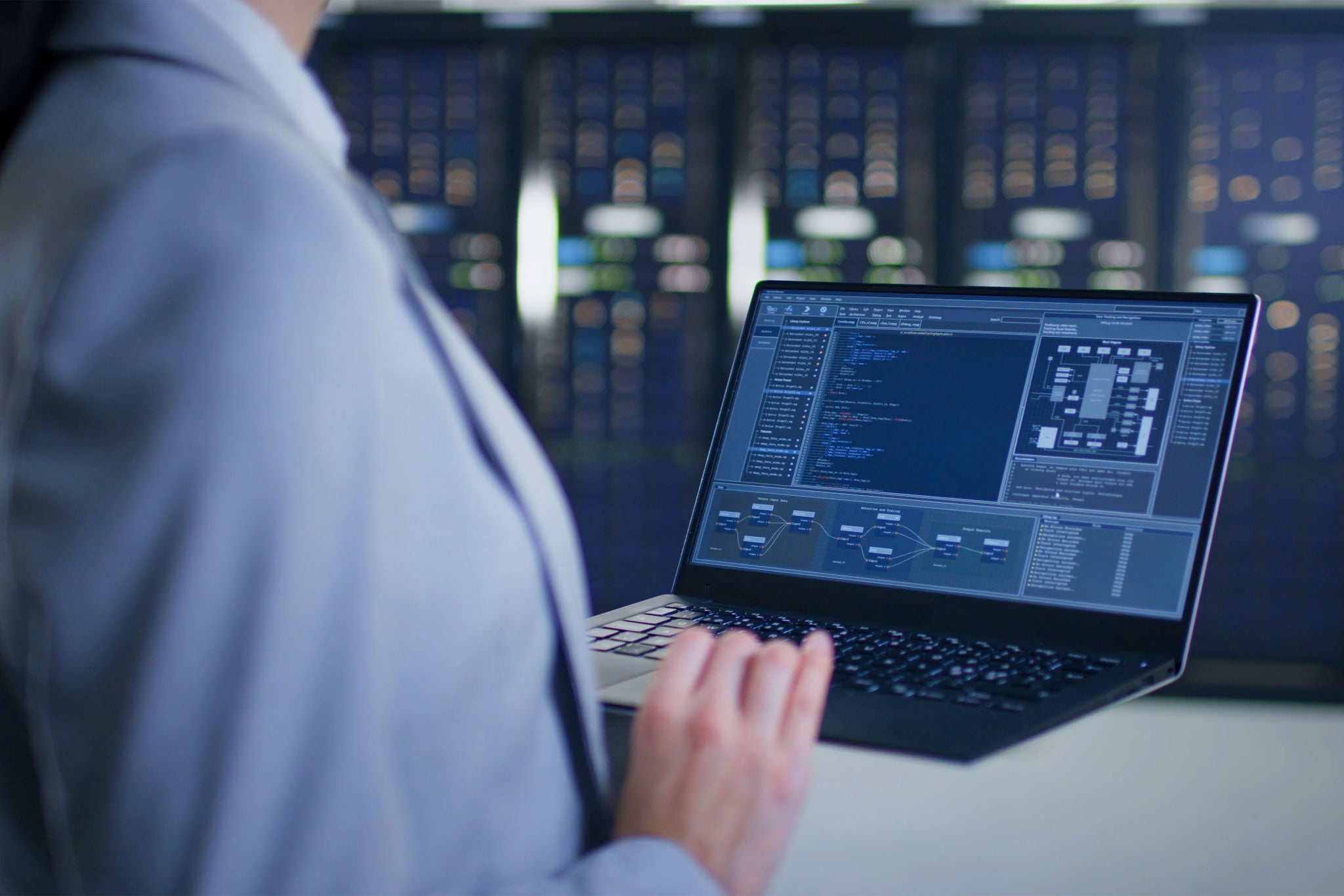 An IT expert is carrying out maintenance work in a server room