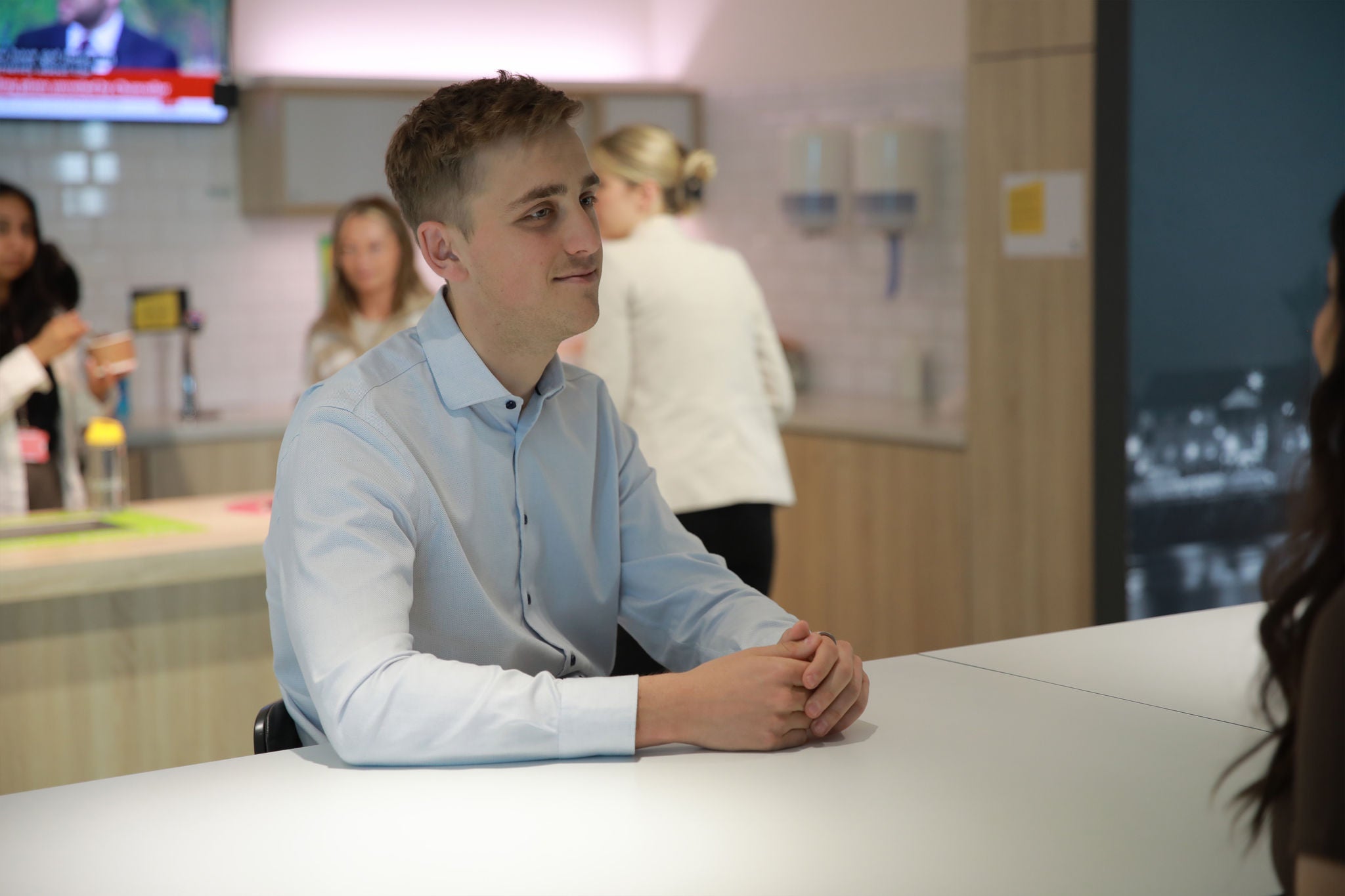 Person sitting in a breakout area