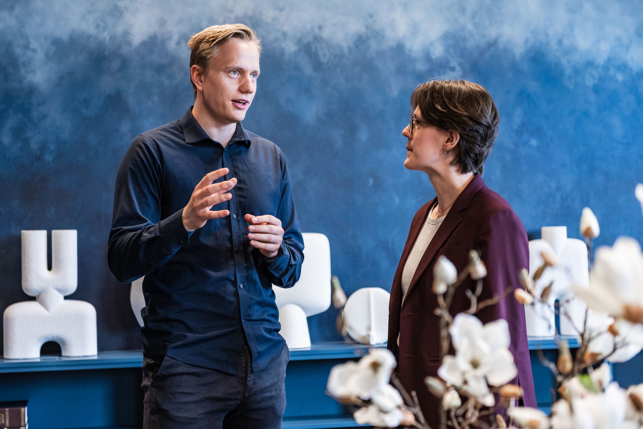 Experienced professionals exchanging insights during a workplace discussion