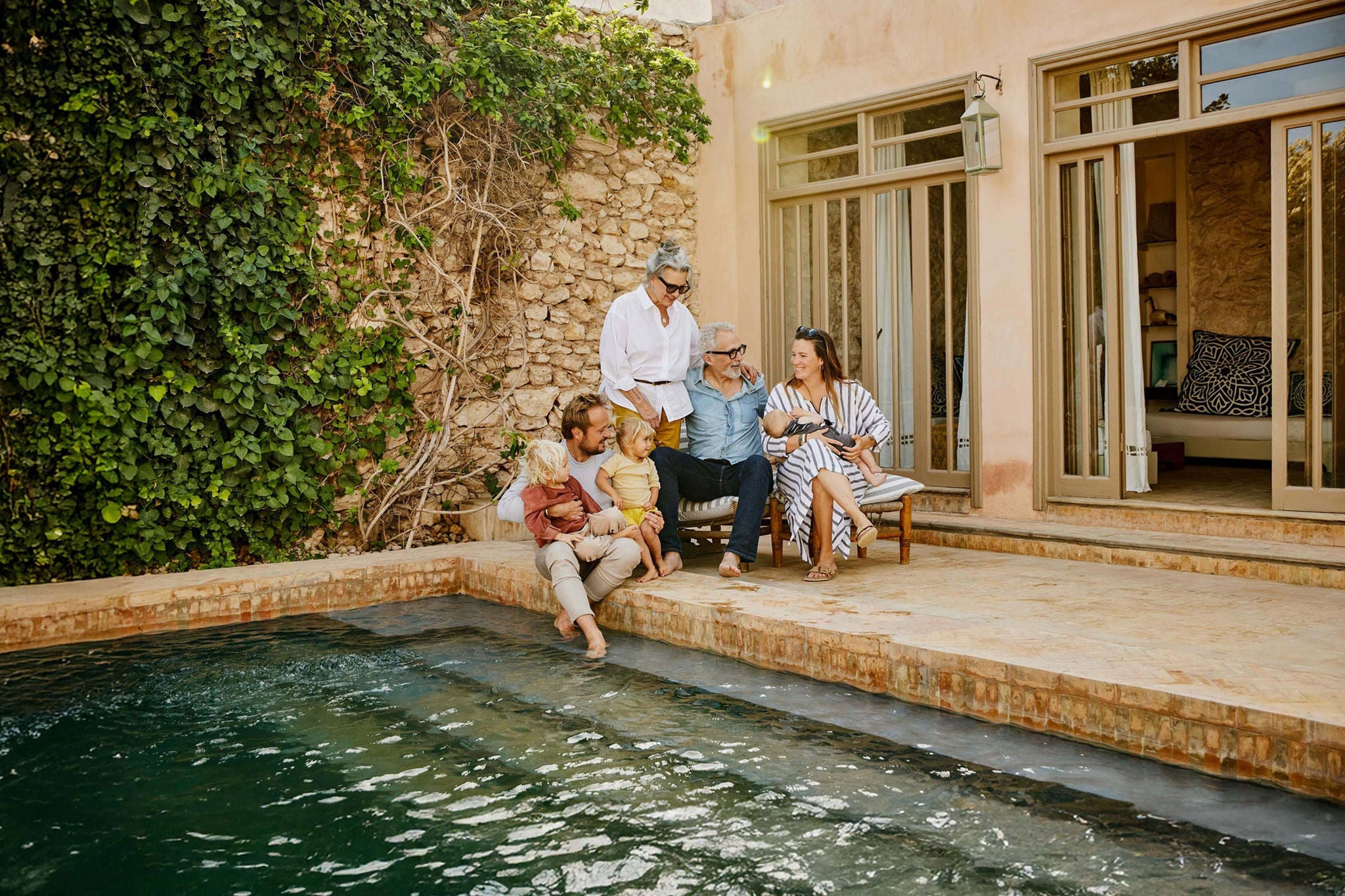 EY Wide Shot smiling family relaxing