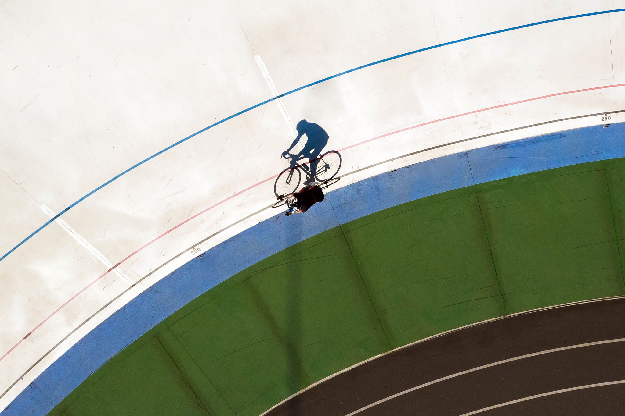Cyclist in training. Top view original shadow shape. Sport poster. Aerial photo