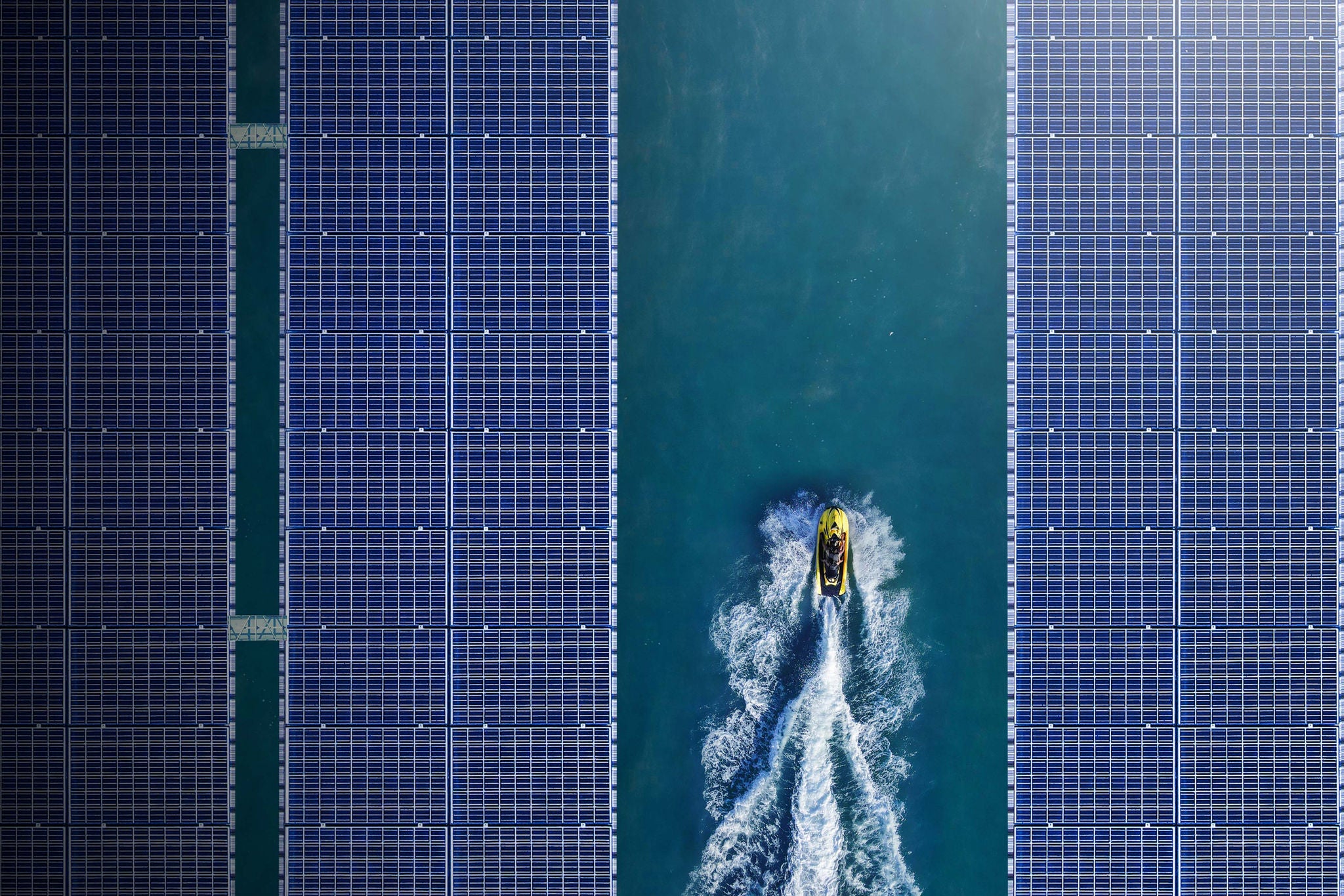 Aerial view/solar panel floating in the dam a clean energy source