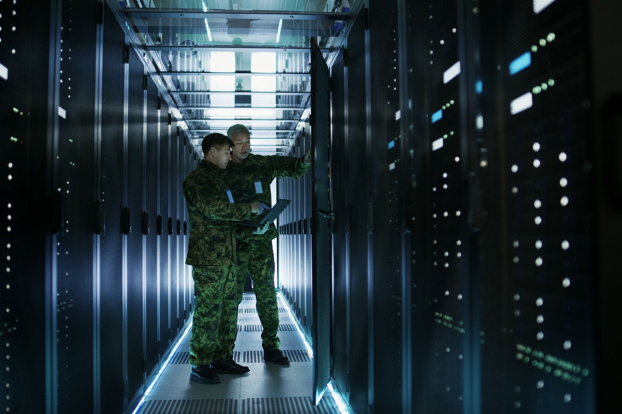 In Data Center Two Military Men Work with Open Server Rack Cabinet