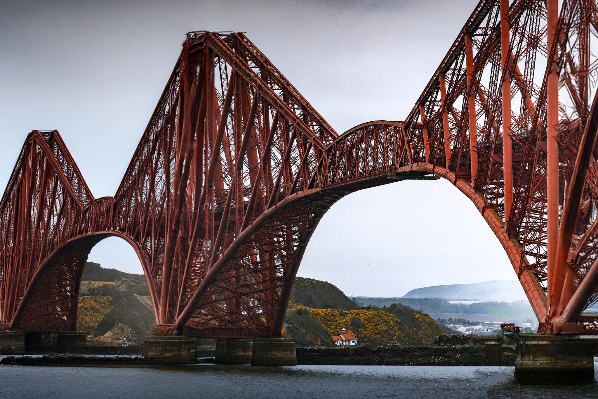 View of the majestic bridge spanning the river with a scenic landscape, South Queensferry, Great Britain.