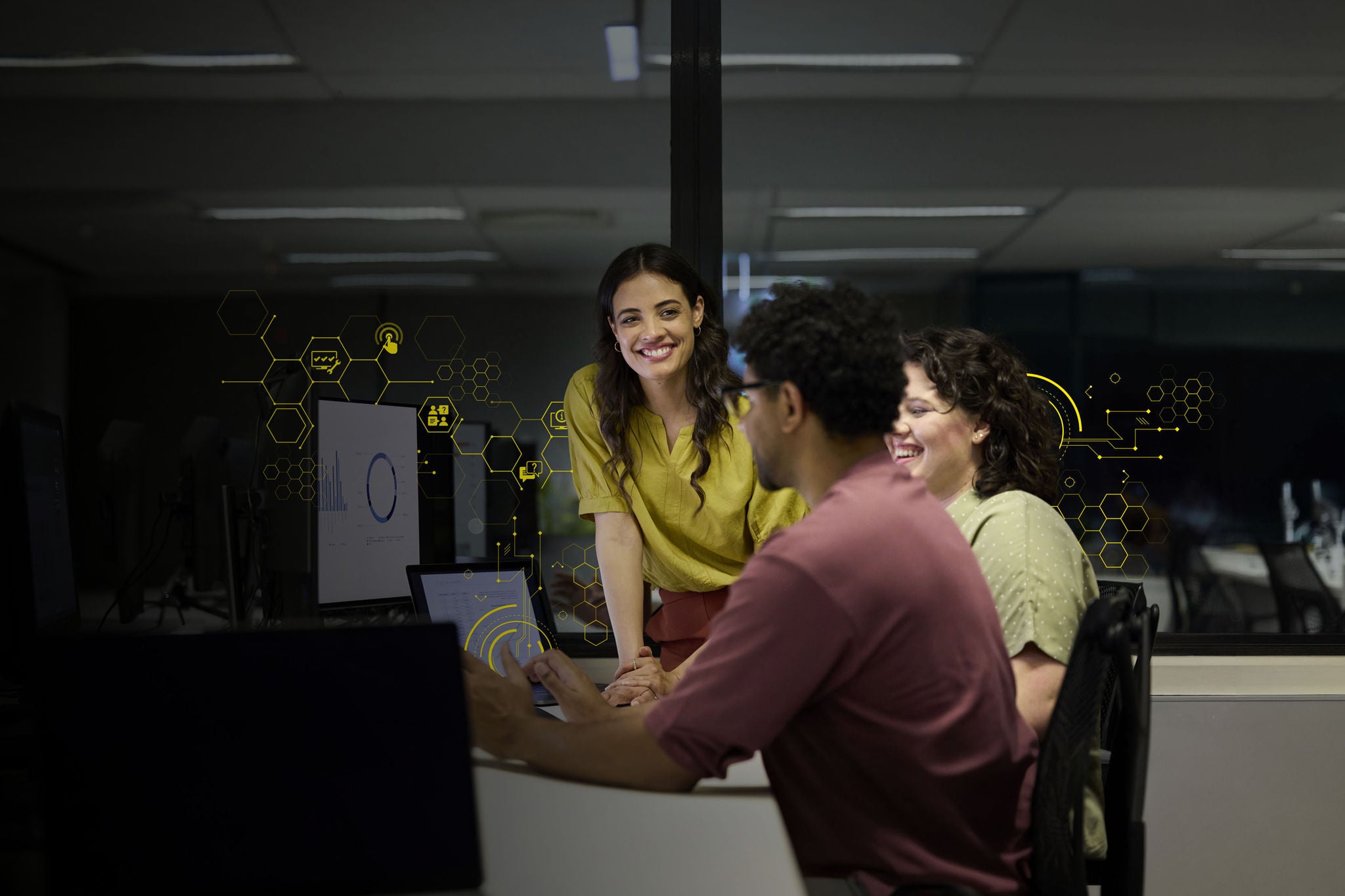Smiling female entrepreneur with colleagues in office