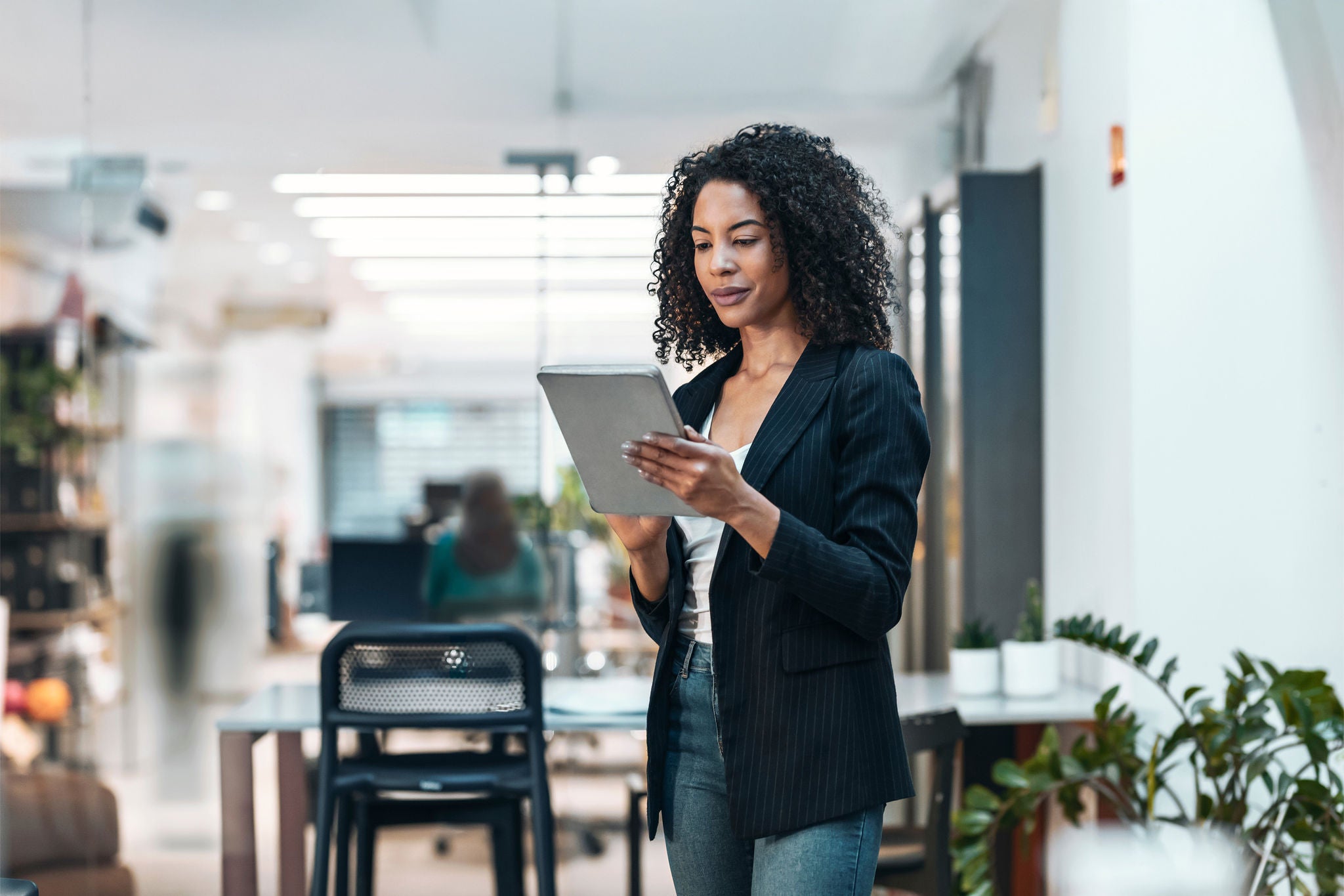 Businesswoman using tablet PC at office