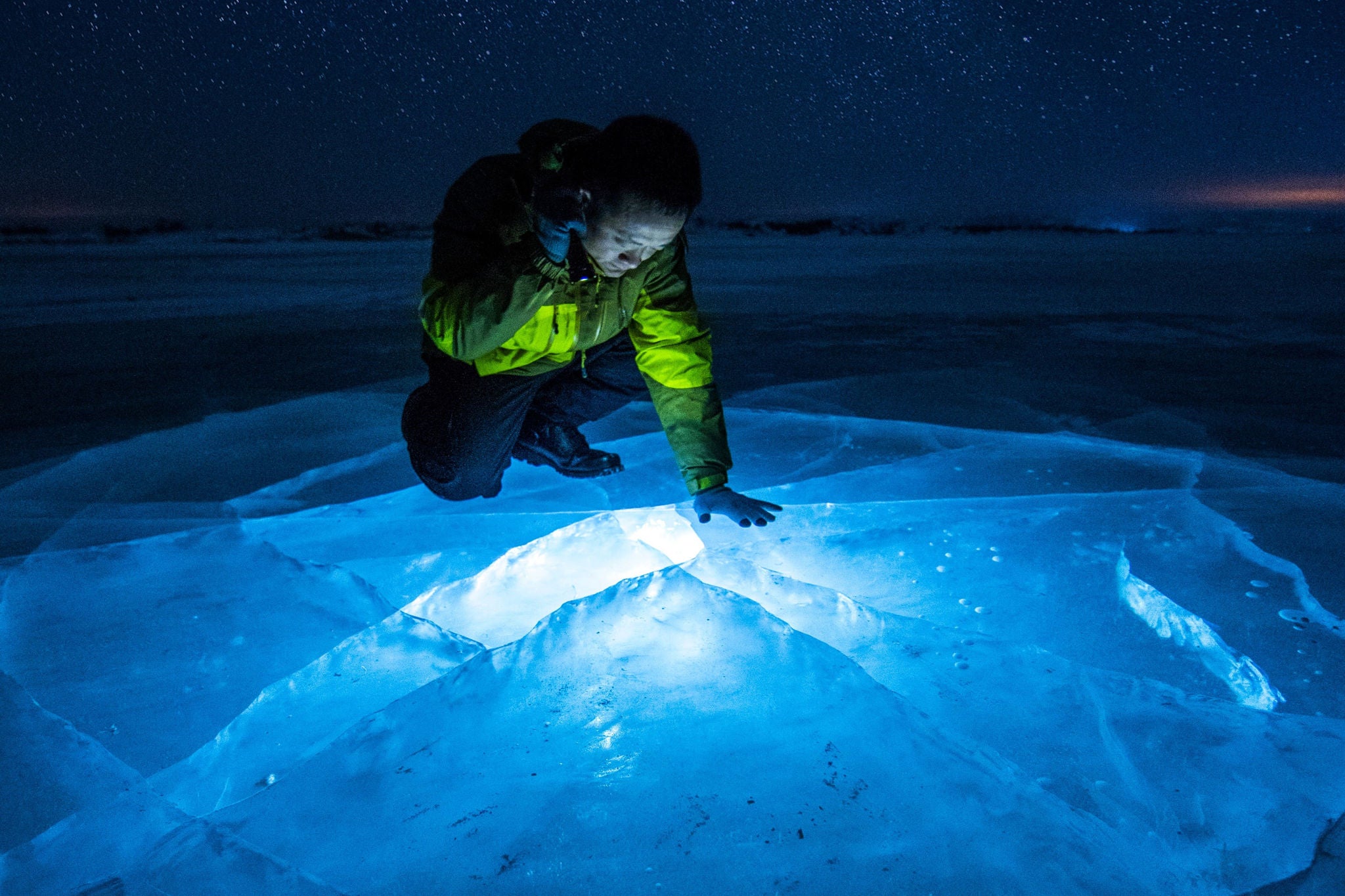 Man shining a light on thin ice