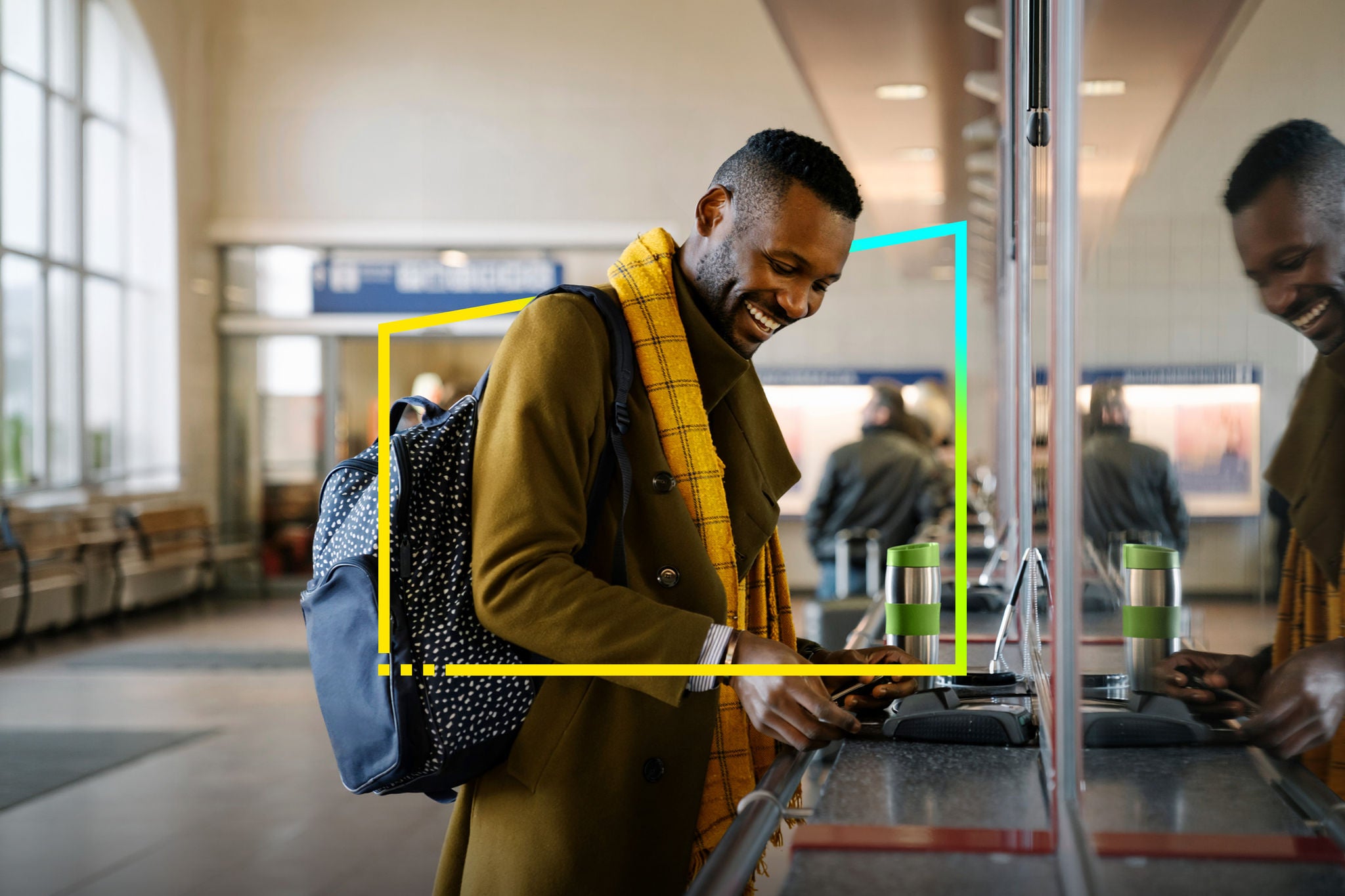 Traveler making contactless payment at train station