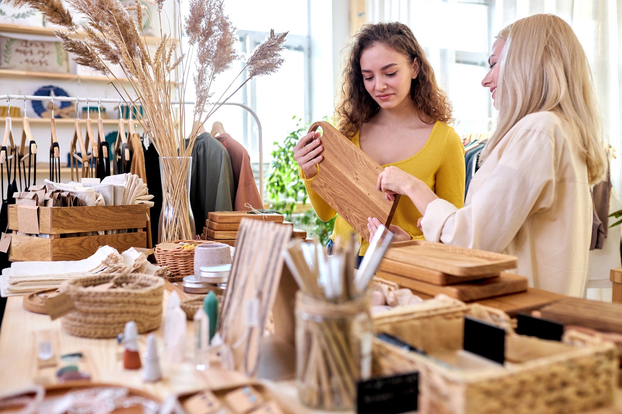 two women buying kitchen items in zero waste shop