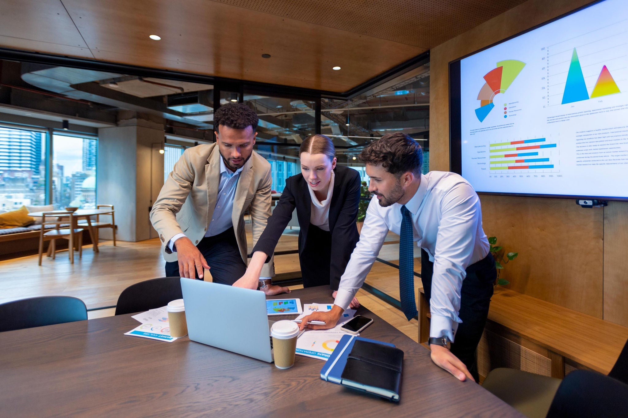 Business people working on a laptop in a modern office
