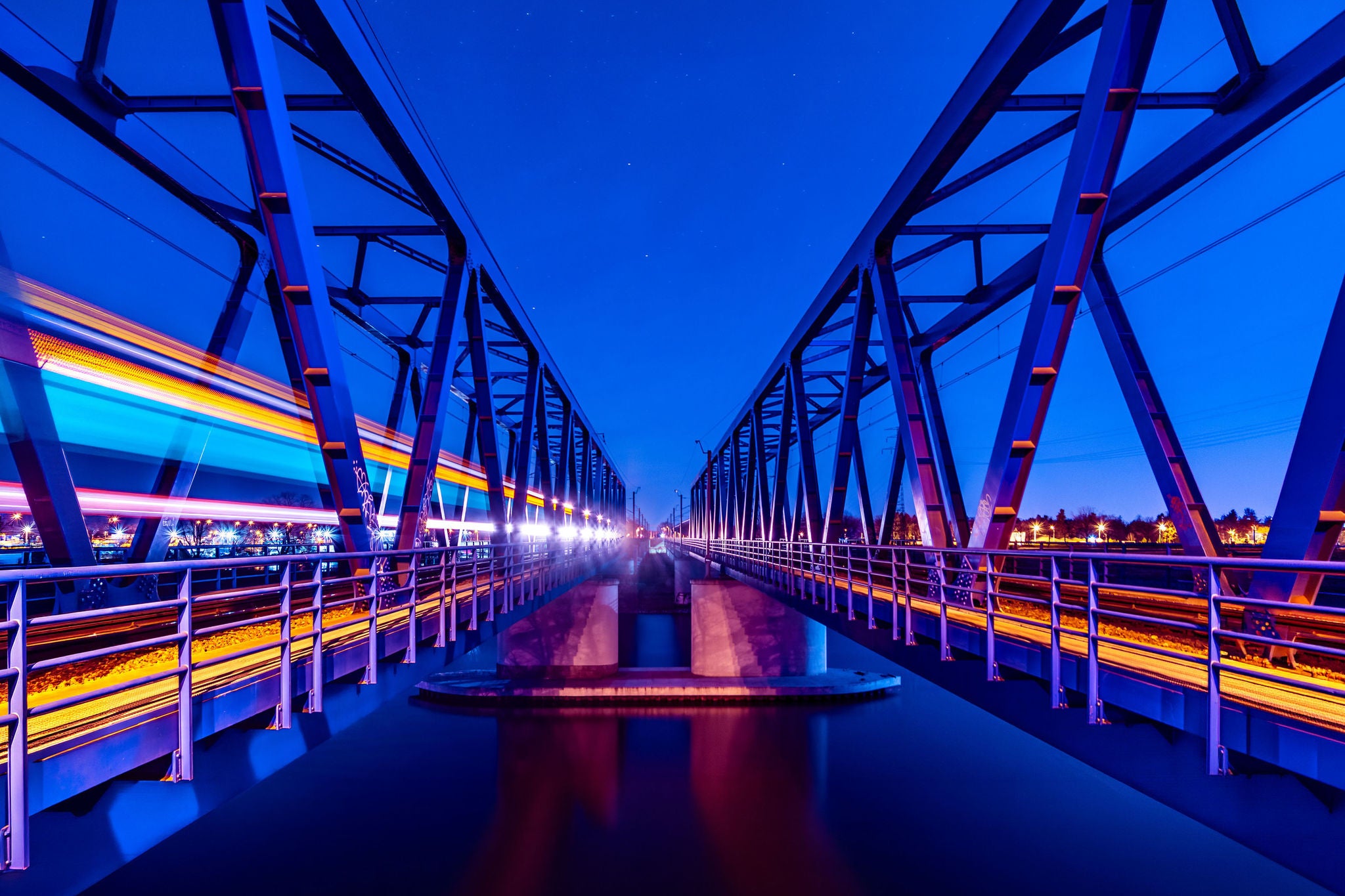 ey-twin-railway-bridges-at-night-under-a-starry-sky