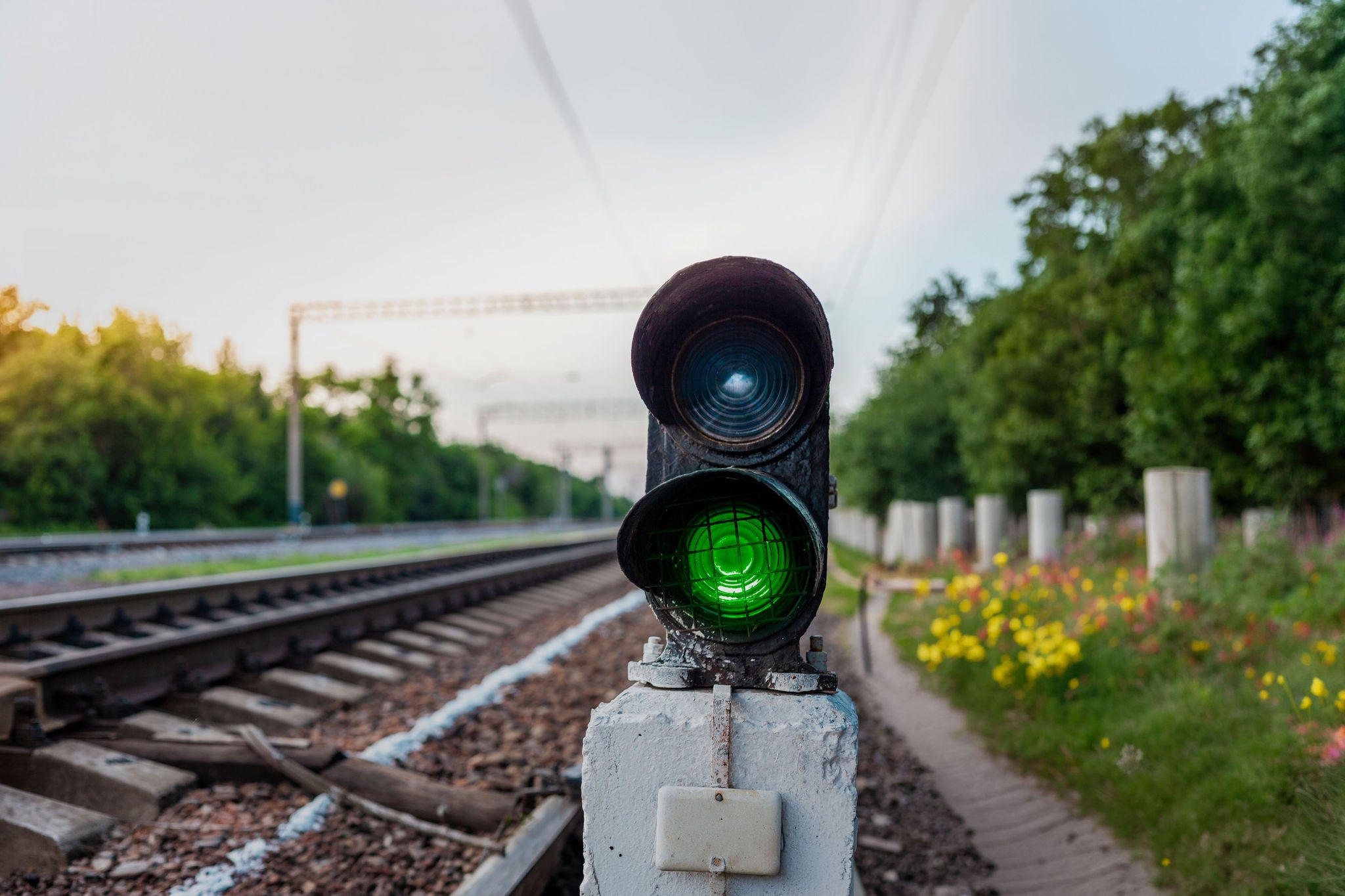 Green traffic lights on the railroad