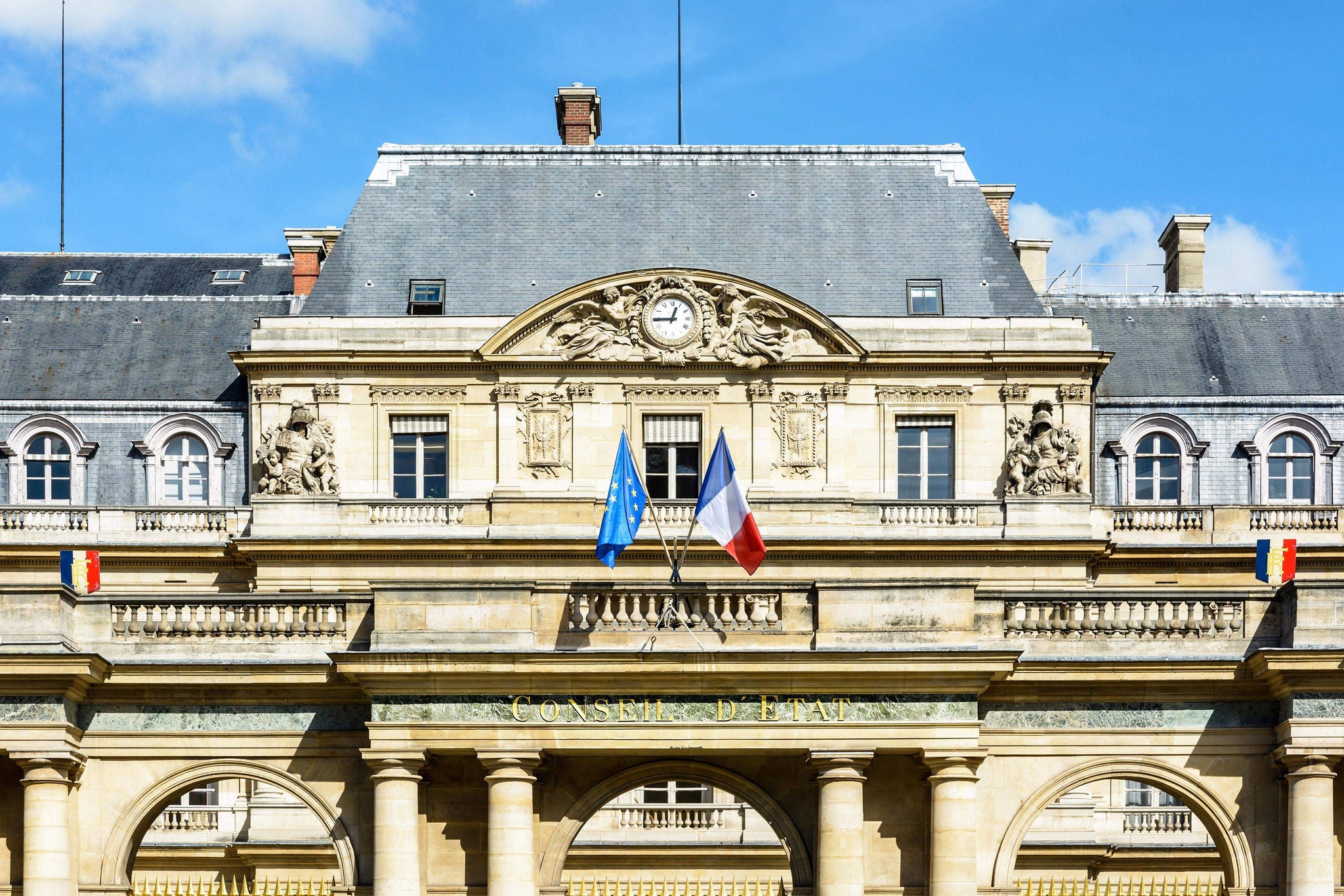 man helping women to cross the stone