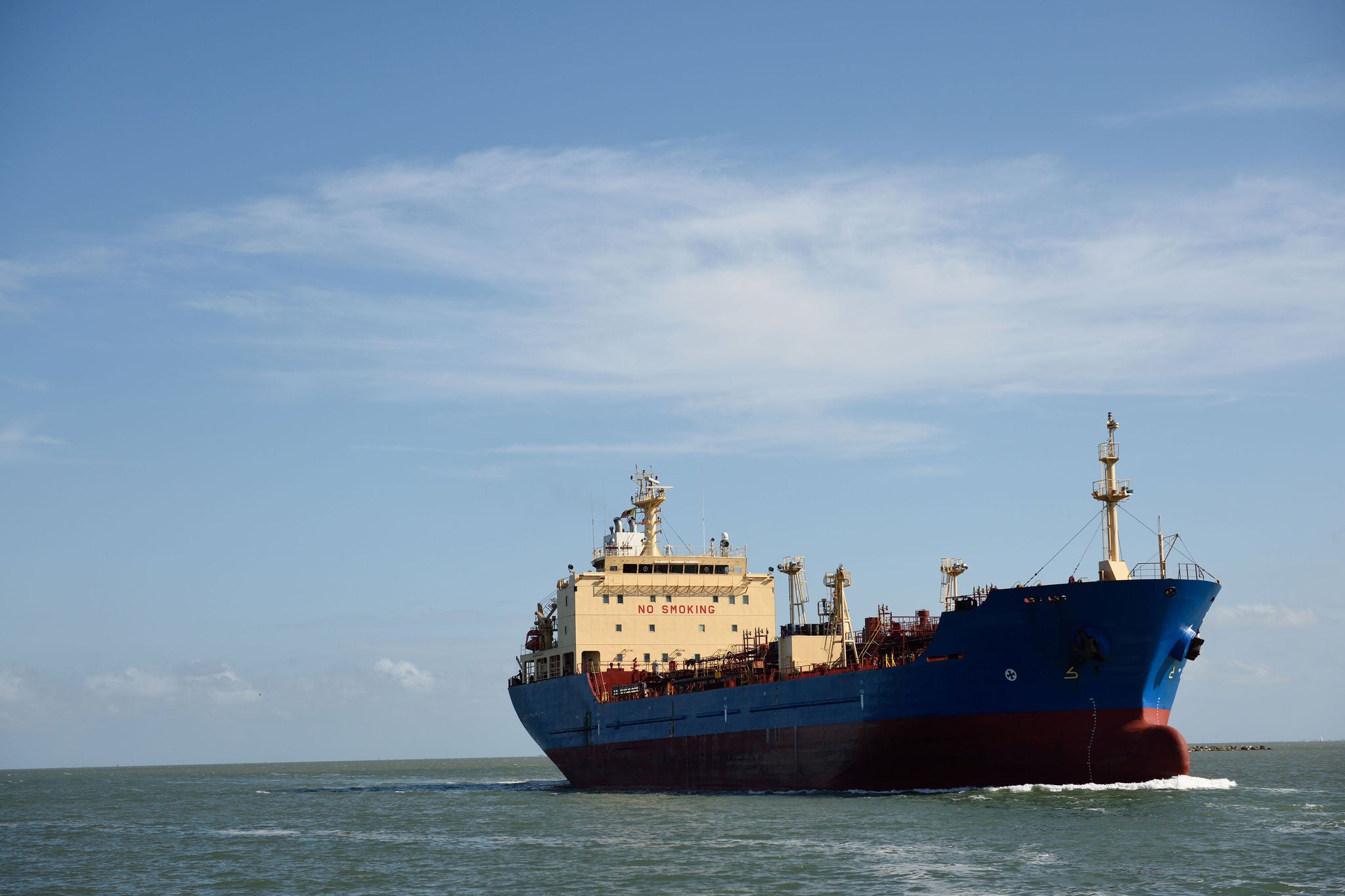 Tanker vessel sailing open seas into port on the gulf of Mexico