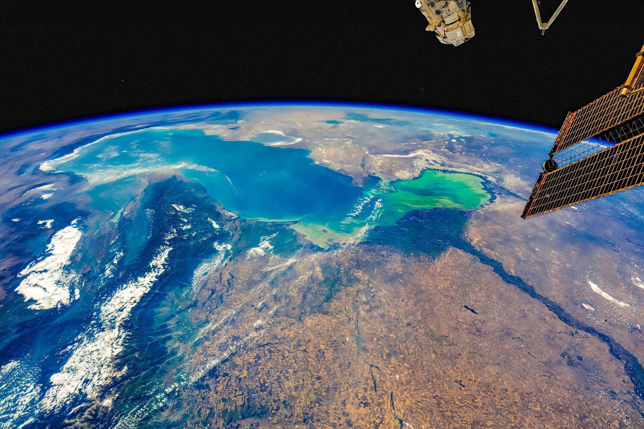 Caspian Sea, Planet Earth. Digital enhancement of an image by NASA. The artist has enhanced sharpness, the white and black point. In addition the artist has added texture, clarity, and dehaze. Colors has been corrected according the artist view of the scene.  Dust spots from the sensor have been removed. 

NASA's Media Usage Guidelines: https://www.nasa.gov/nasa-brand-center/images-and-media/

Original link to the image: https://eol.jsc.nasa.gov/SearchPhotos/photo.pl?mission=ISS073&roll=E&frame=511449