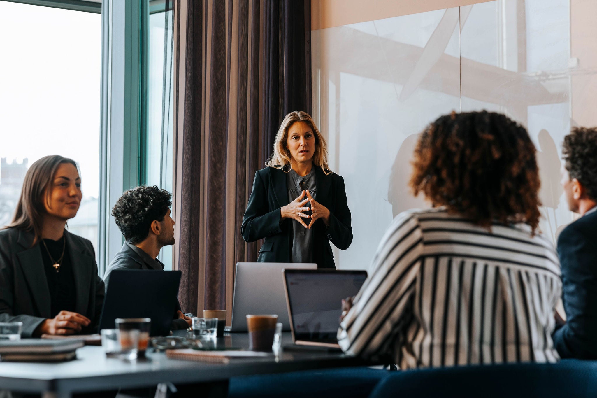 Planning business strategies with colleagues in board room