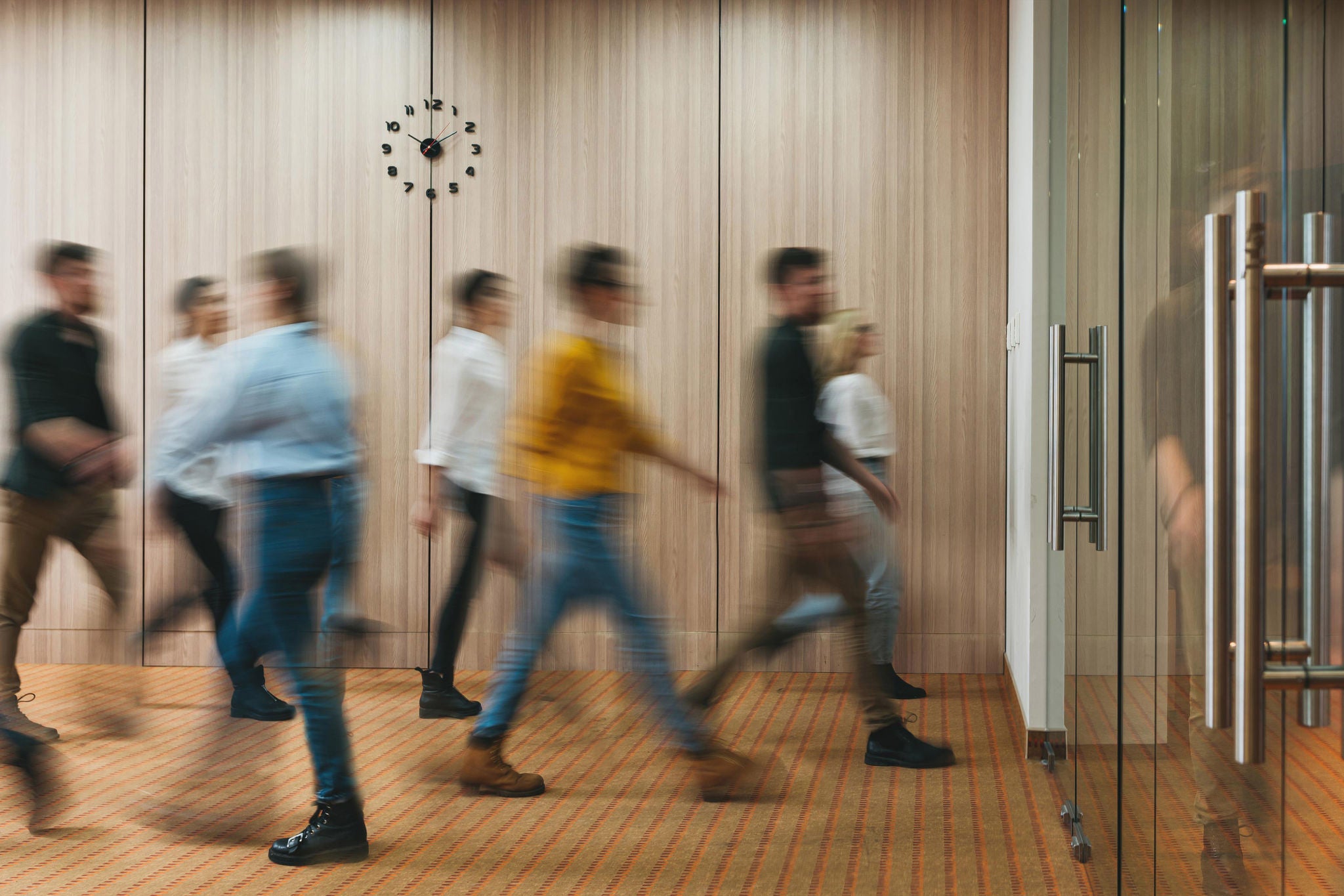 Group of office people walking at office open space. Team of business employees at coworking center. People at motion blur. Concept working at action