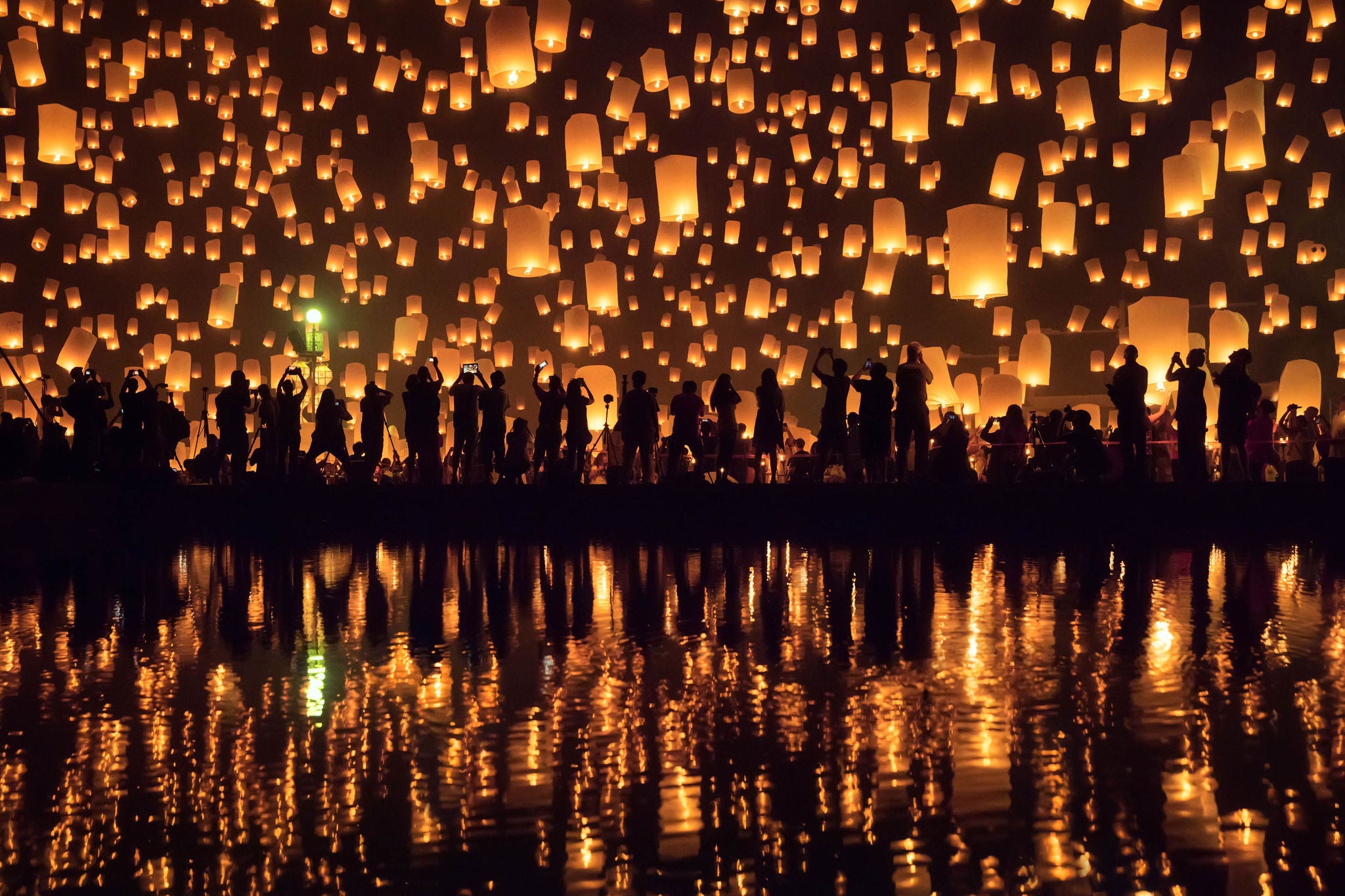 People releasing lantern at a festival