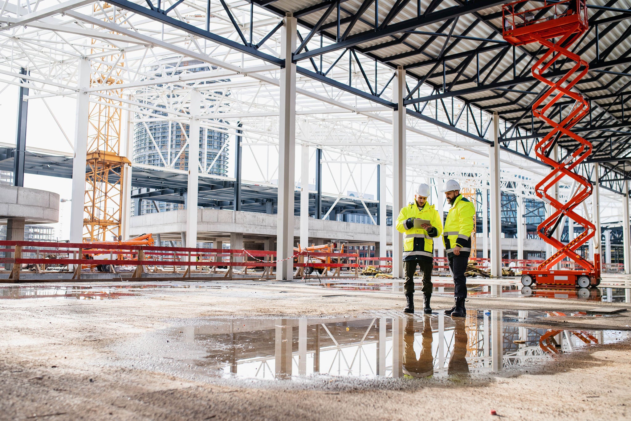  Front view of men engineers standing outdoors on construction site
