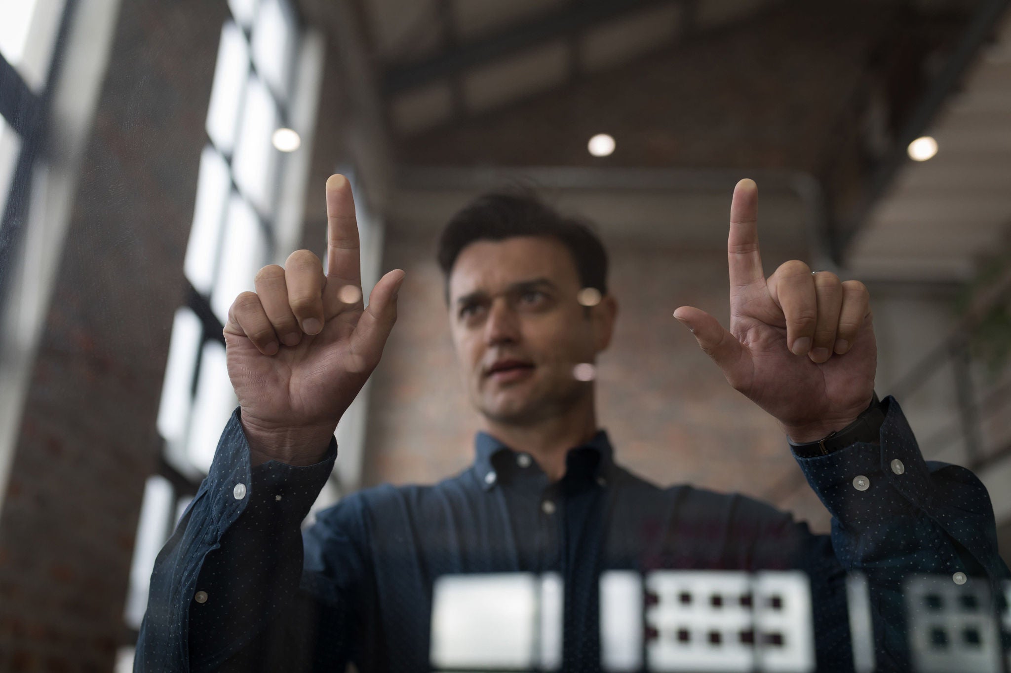 Businessman using an invisible screen