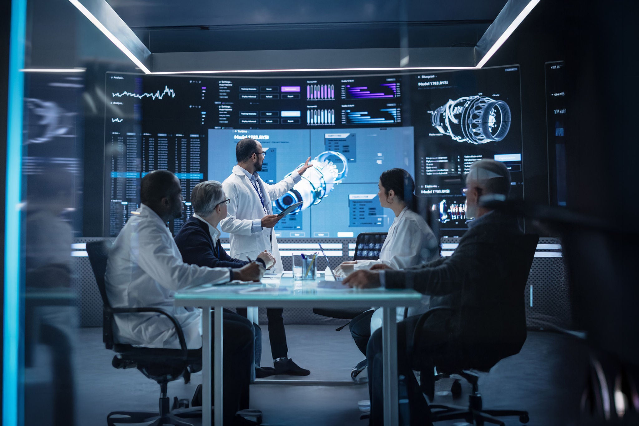 Team of Industrial Engineers Having a Meeting in a Research and Development Science Laboratory. Diverse Group of Professionals Discussing New Turbine Design ... 
