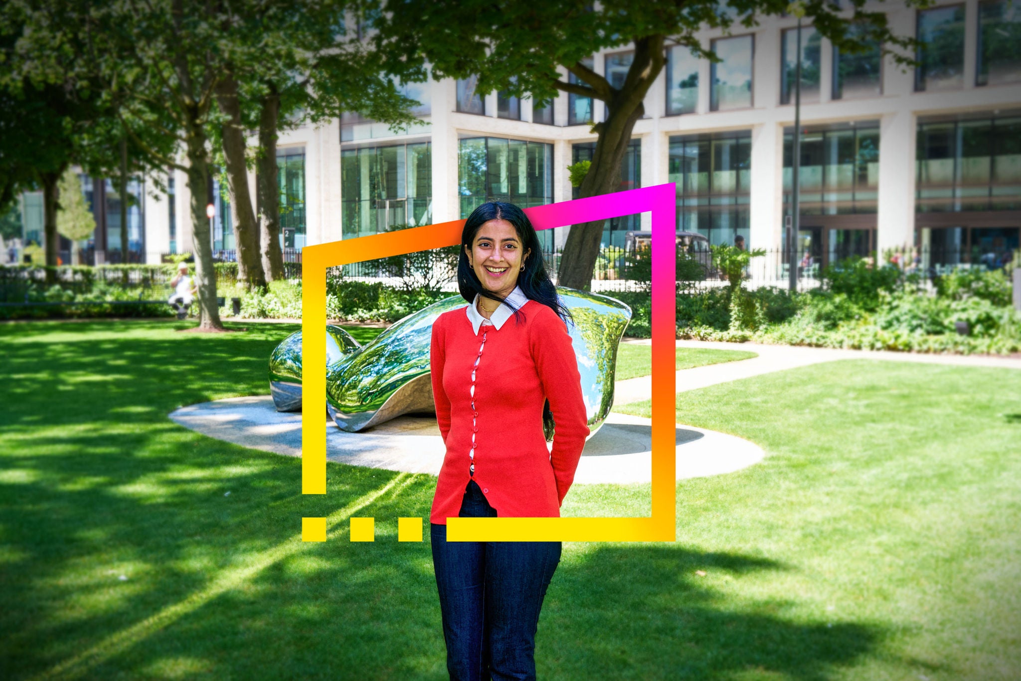 Nisha standing in a landscaped business park with EY brand frame graphic