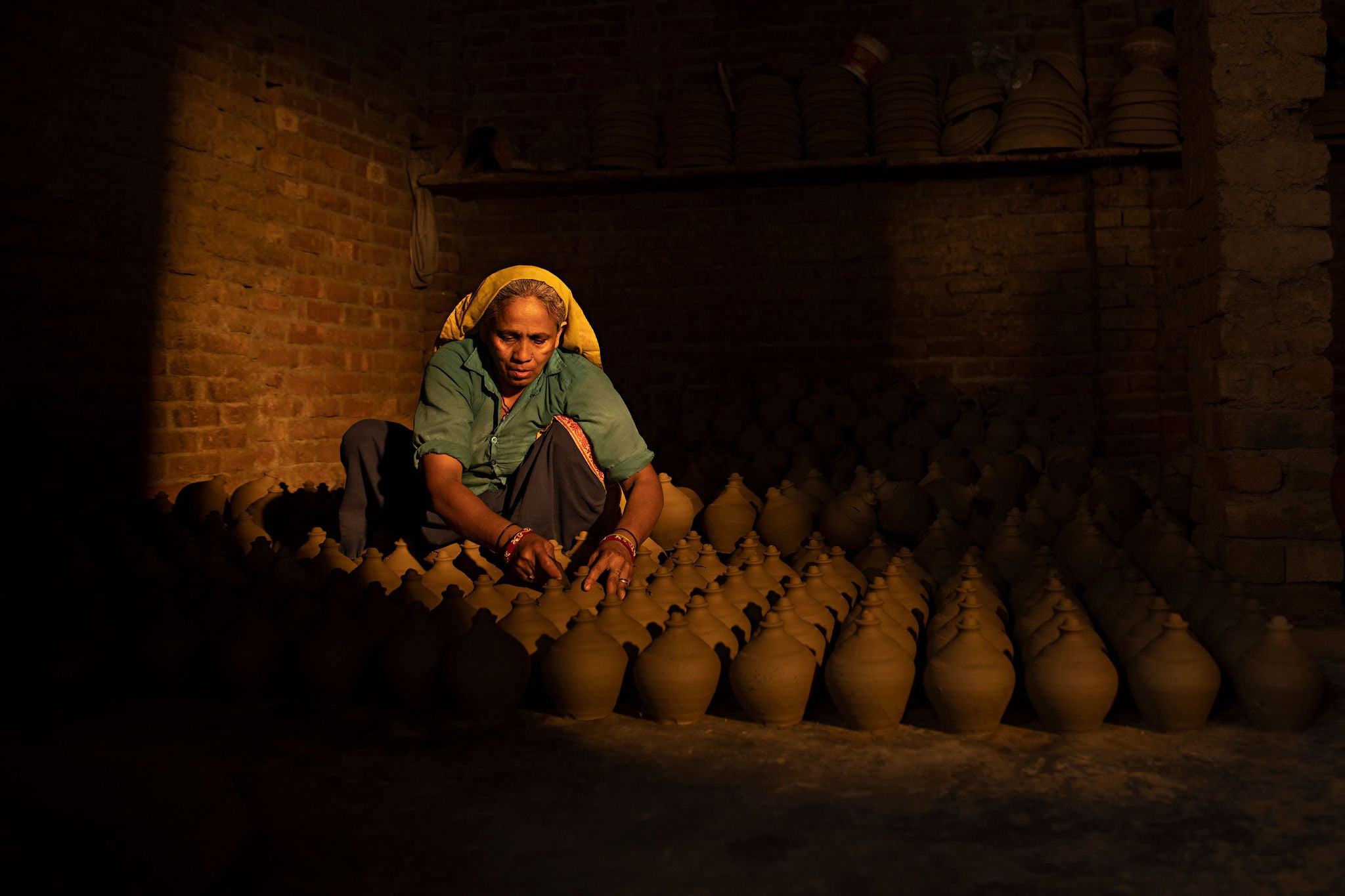 Mature woman preparing earthenware