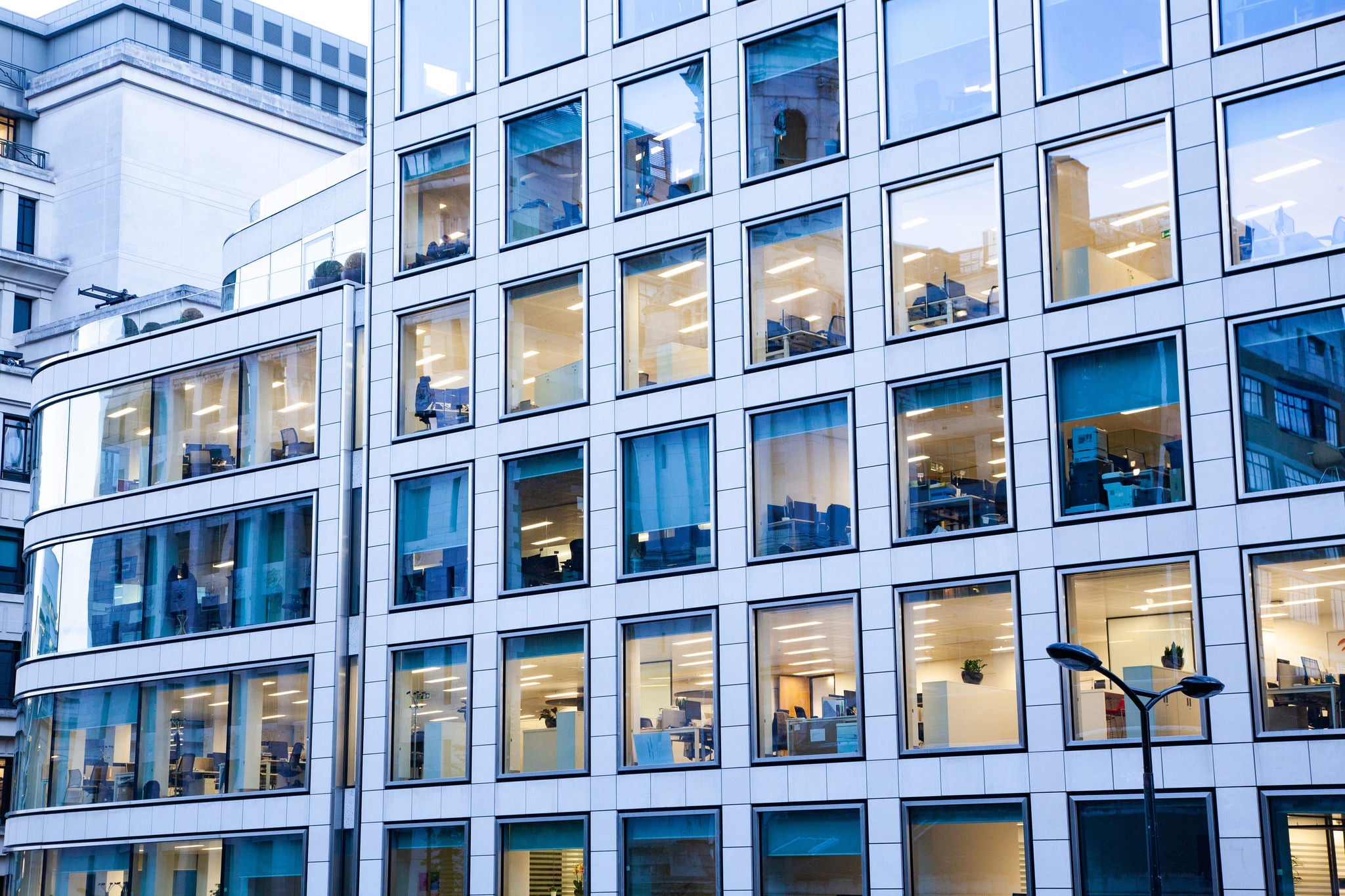 Man working on laptop while sitting in kitchen at home