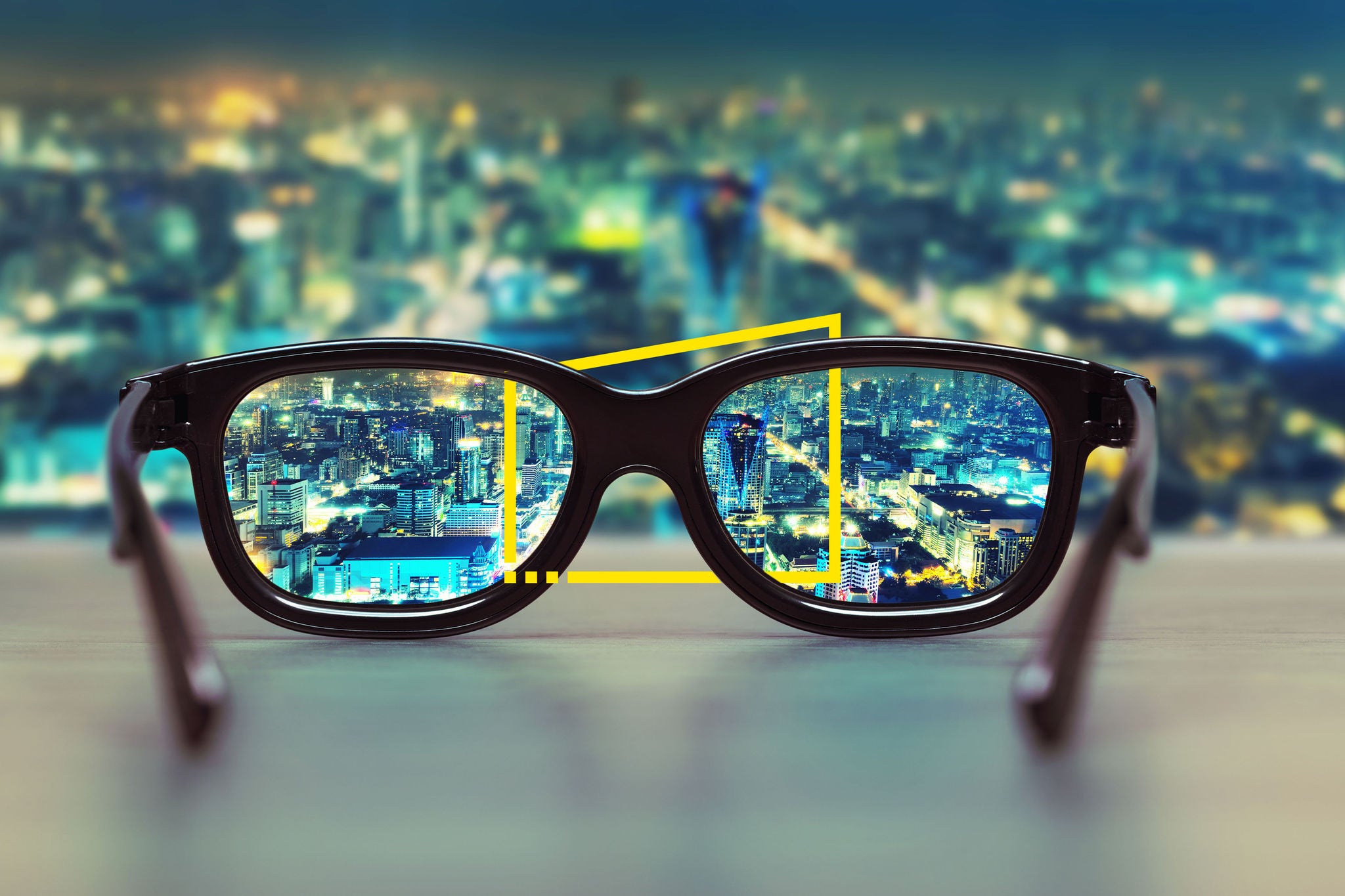 Night cityscape focused in glasses lenses; Shutterstock ID 225924757