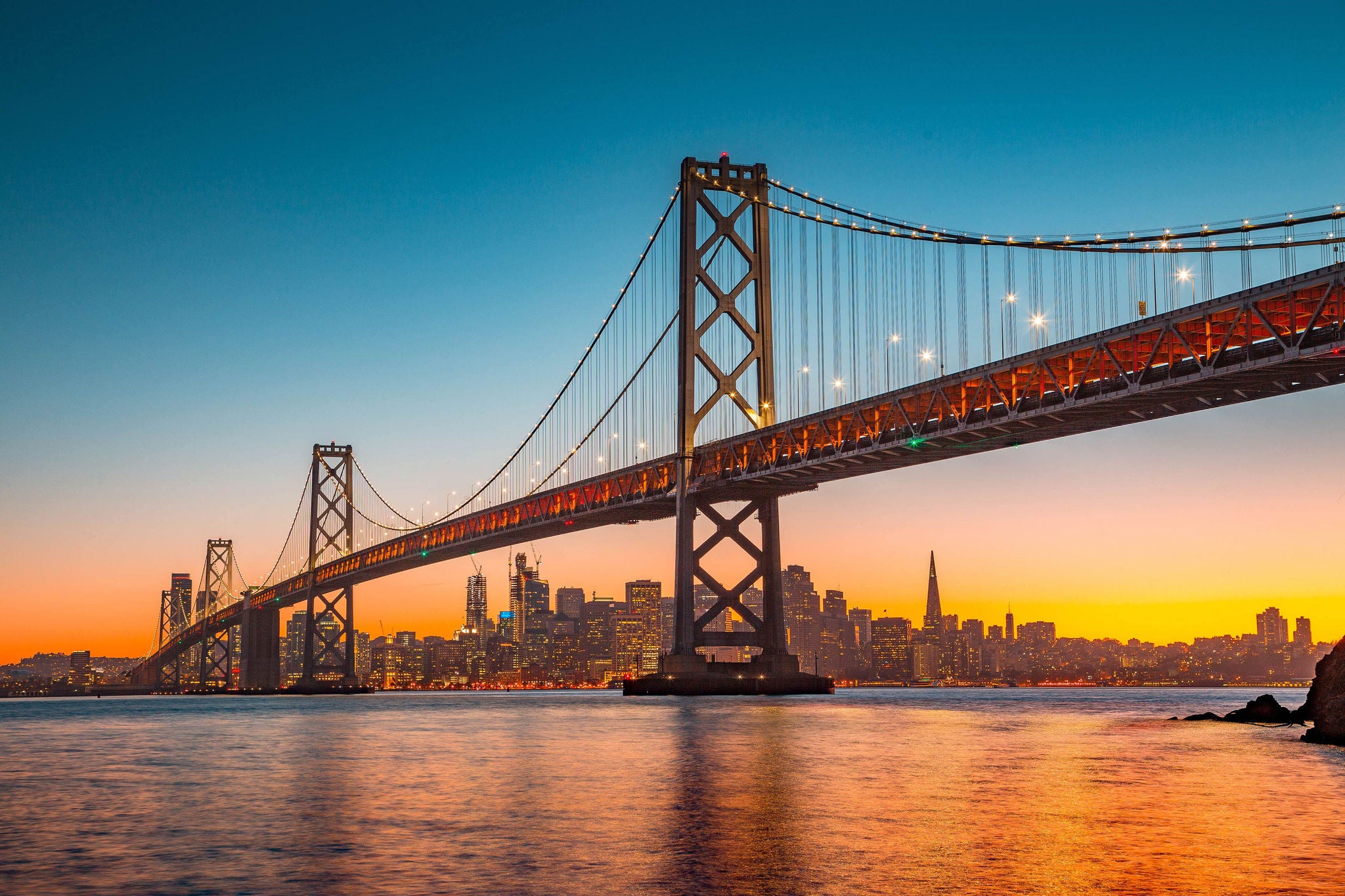 San Francisco skyline with Bay Bridge at sunset, California, USA