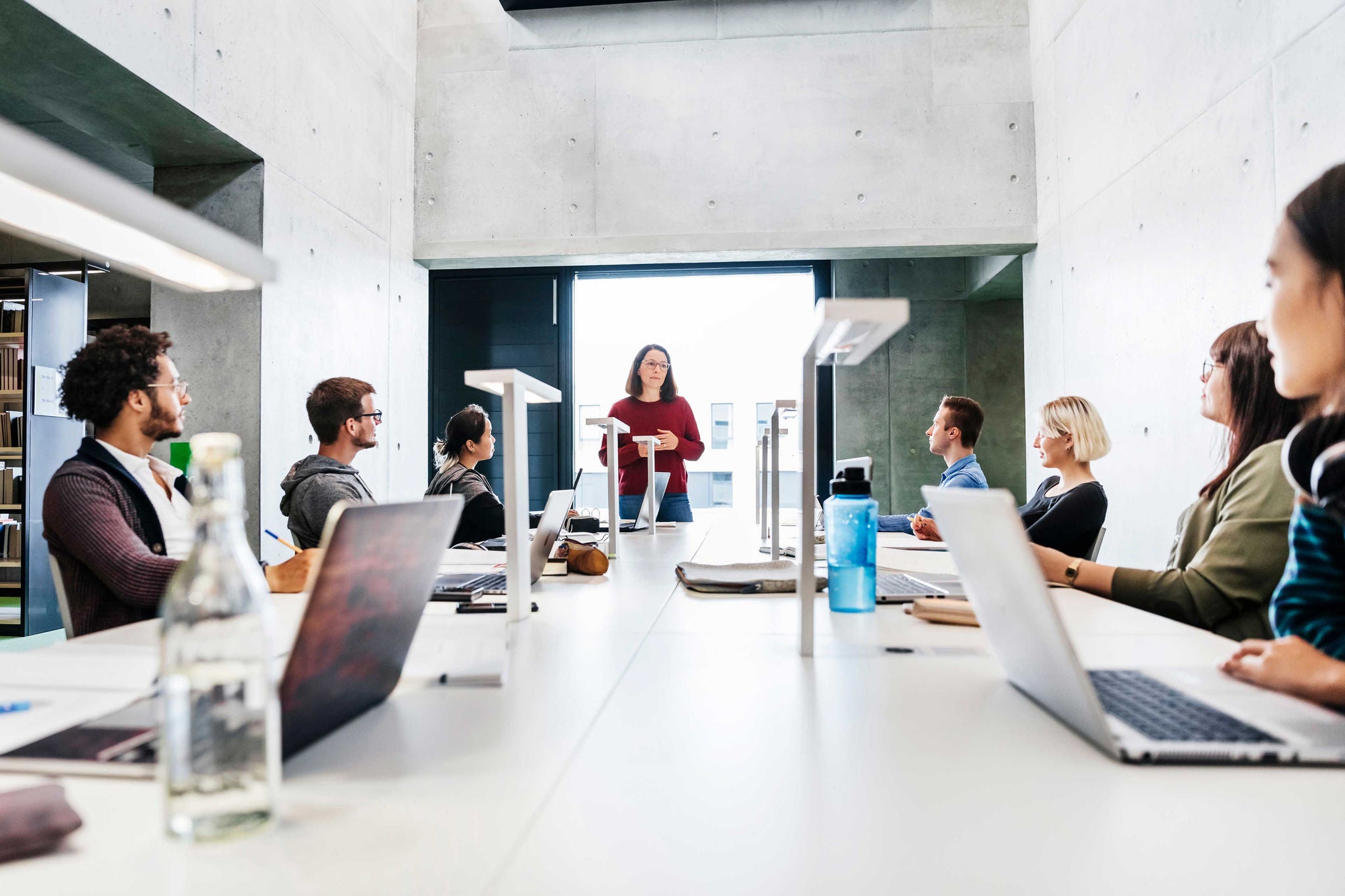 Students Listening To Teacher During Seminar In Library
