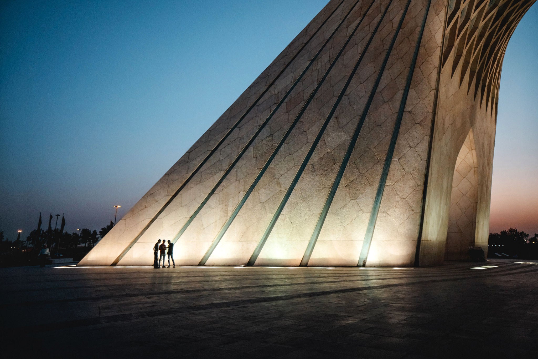 People in front of The 148-foot high Azadi (Freedom) Tower 