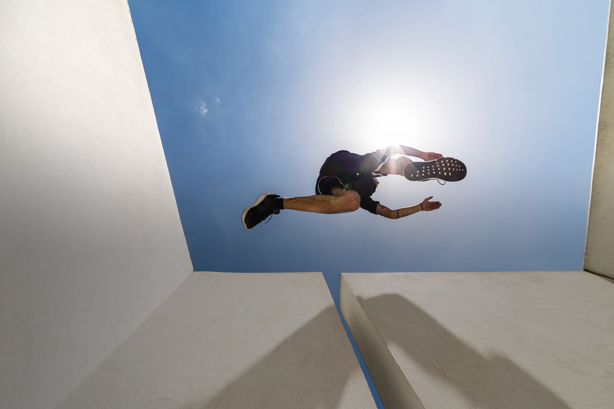 Man jumping in the city during a parkour session