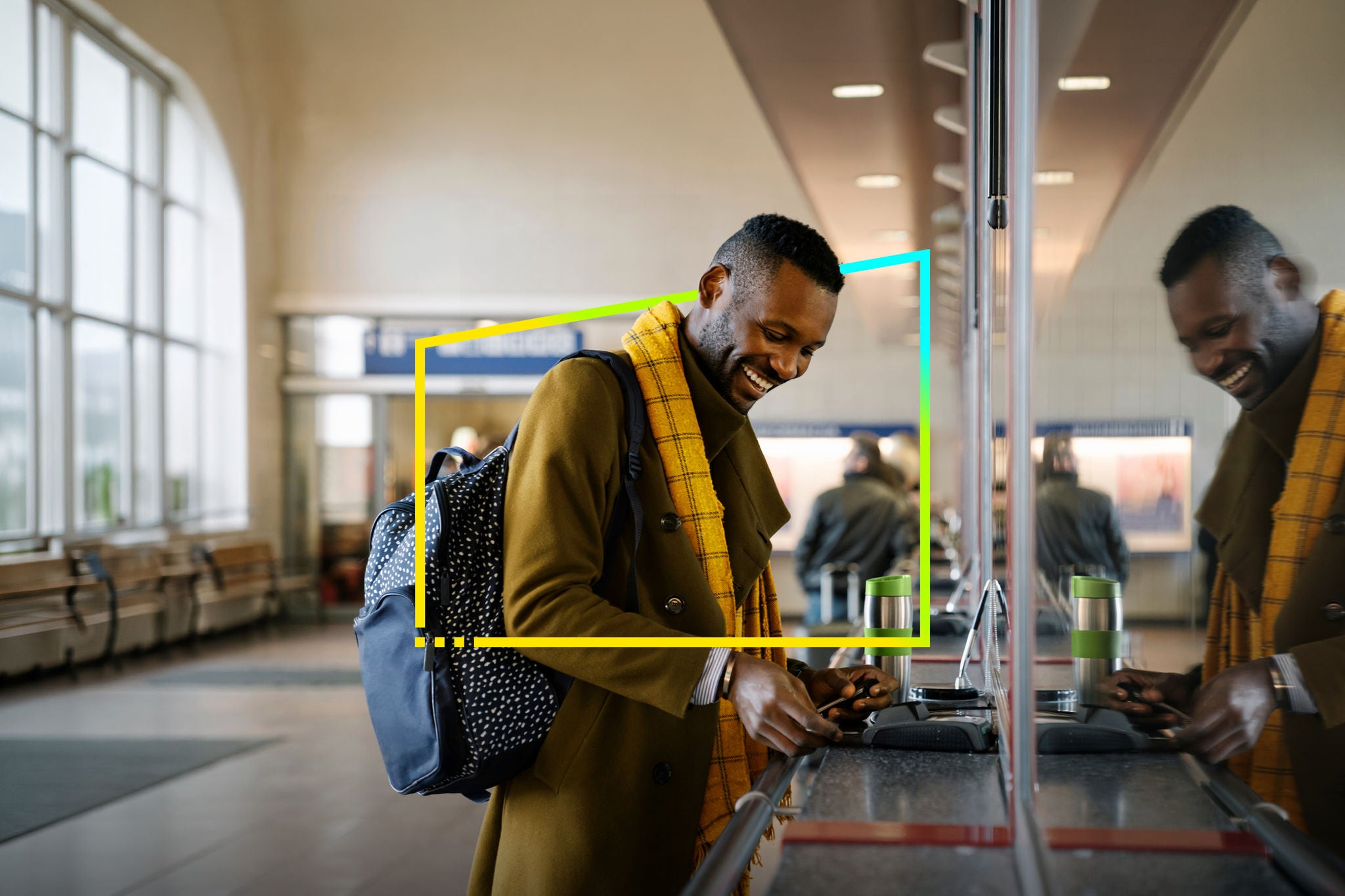 Traveler making contactless payment at train station
