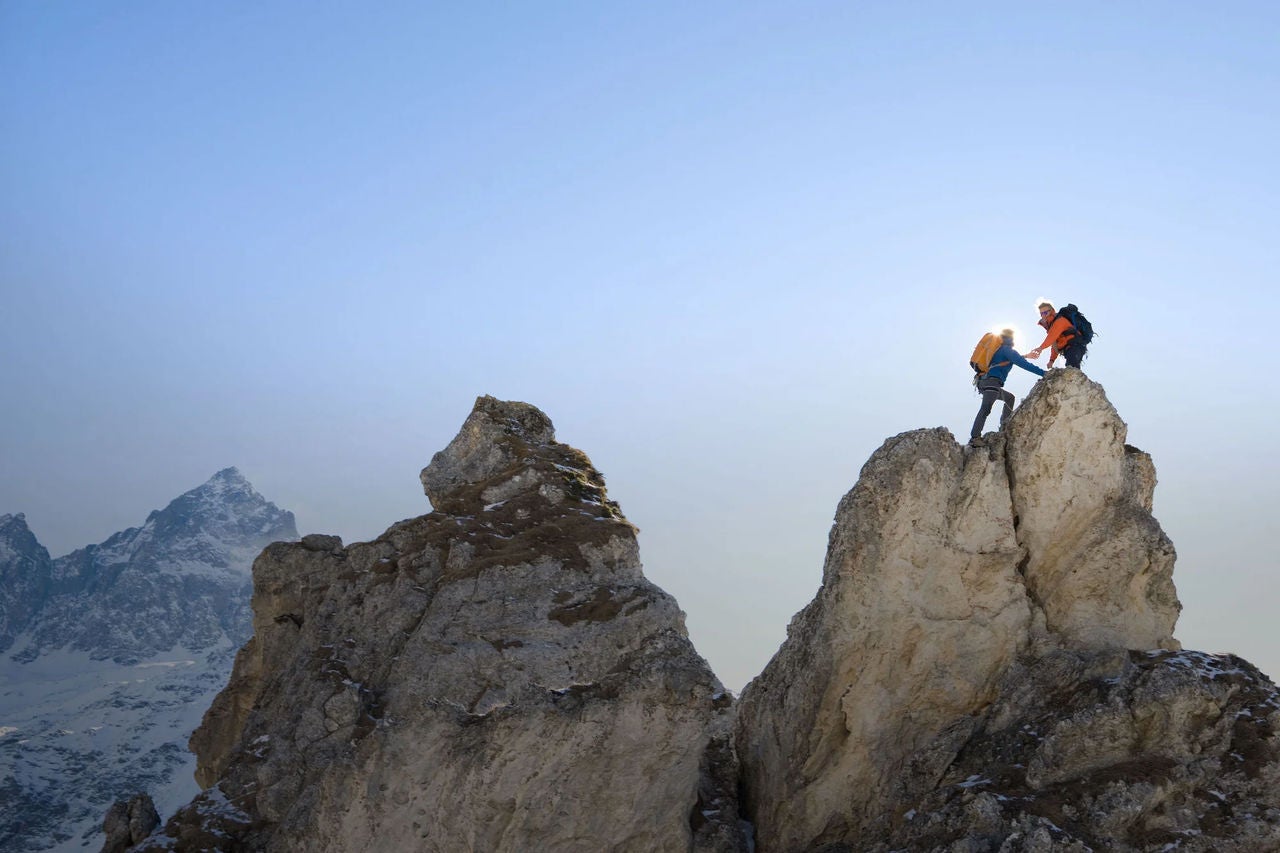 Hikers climbing up a mountain