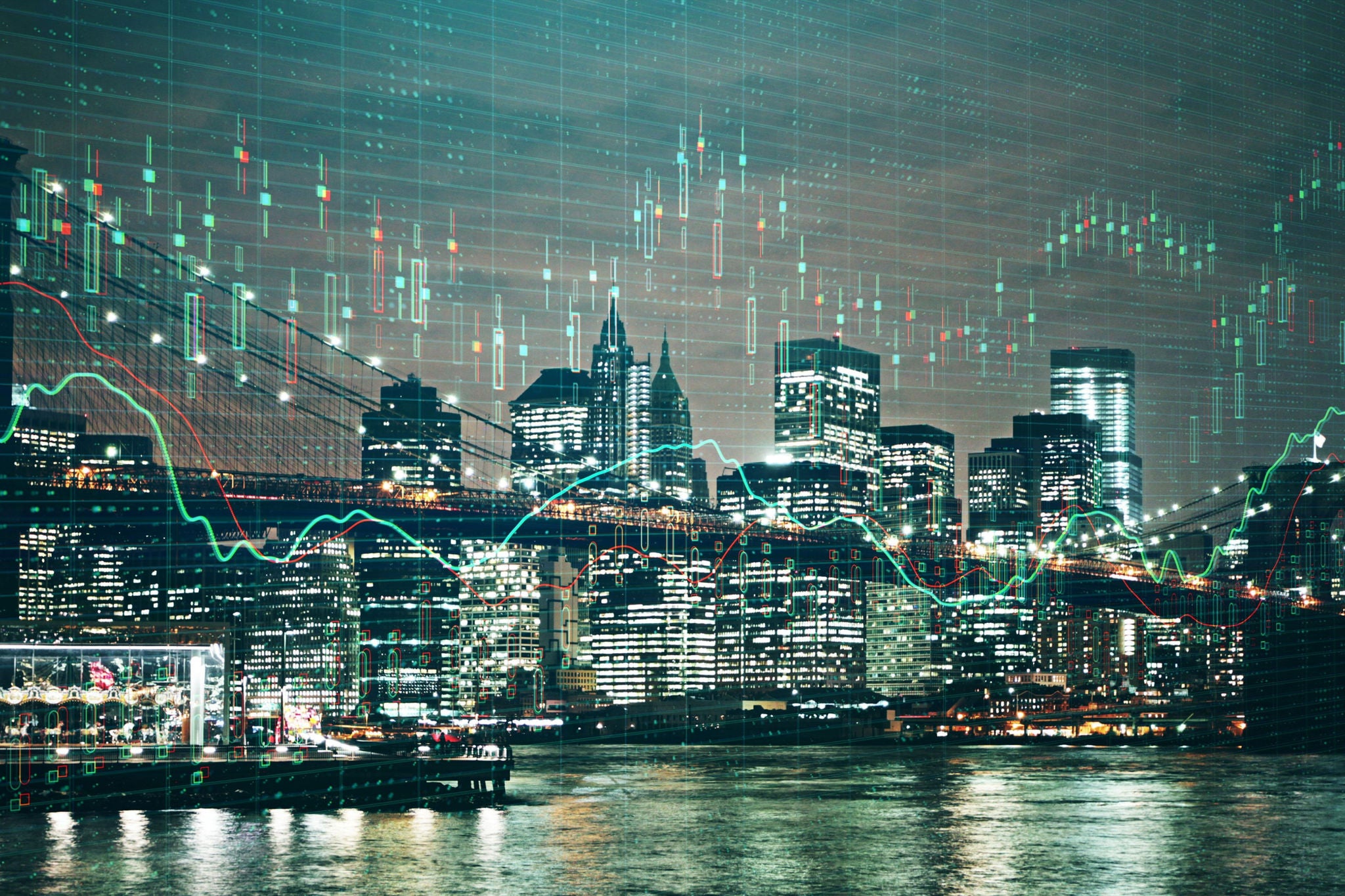 Drone view over a field of solar panels at sunset