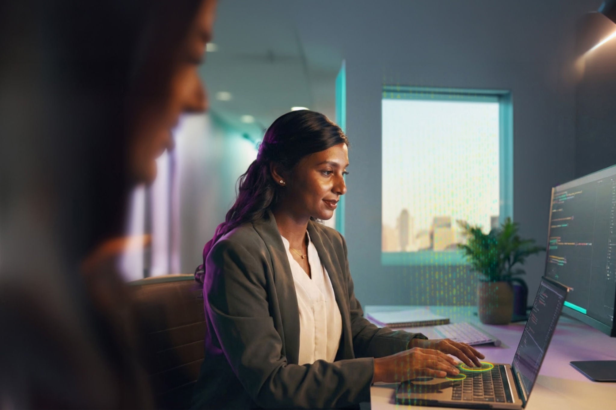 woman working on laptop in modern office