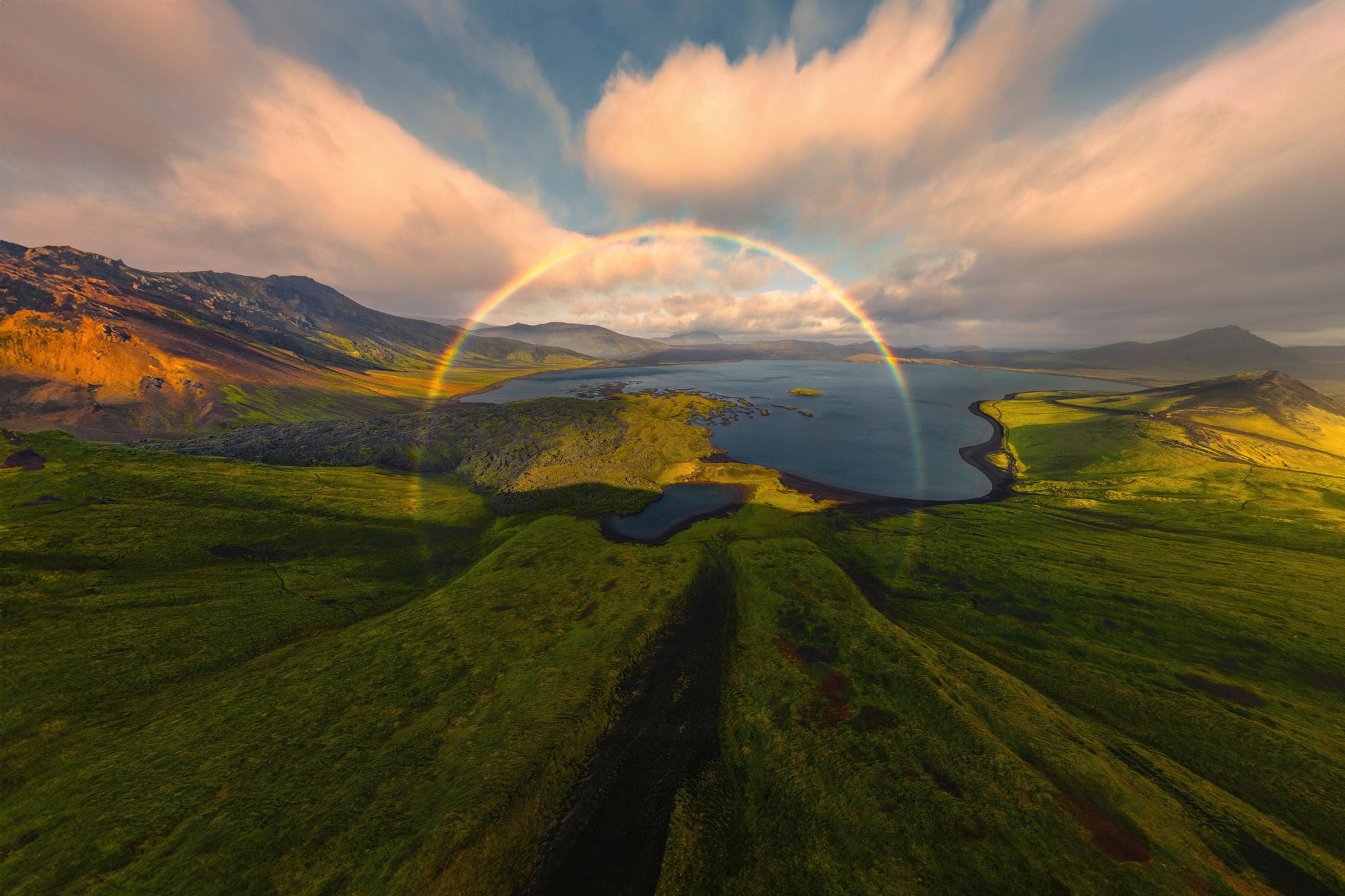 Aerial view of frostastaoavatn lake with a vibrant rainbow