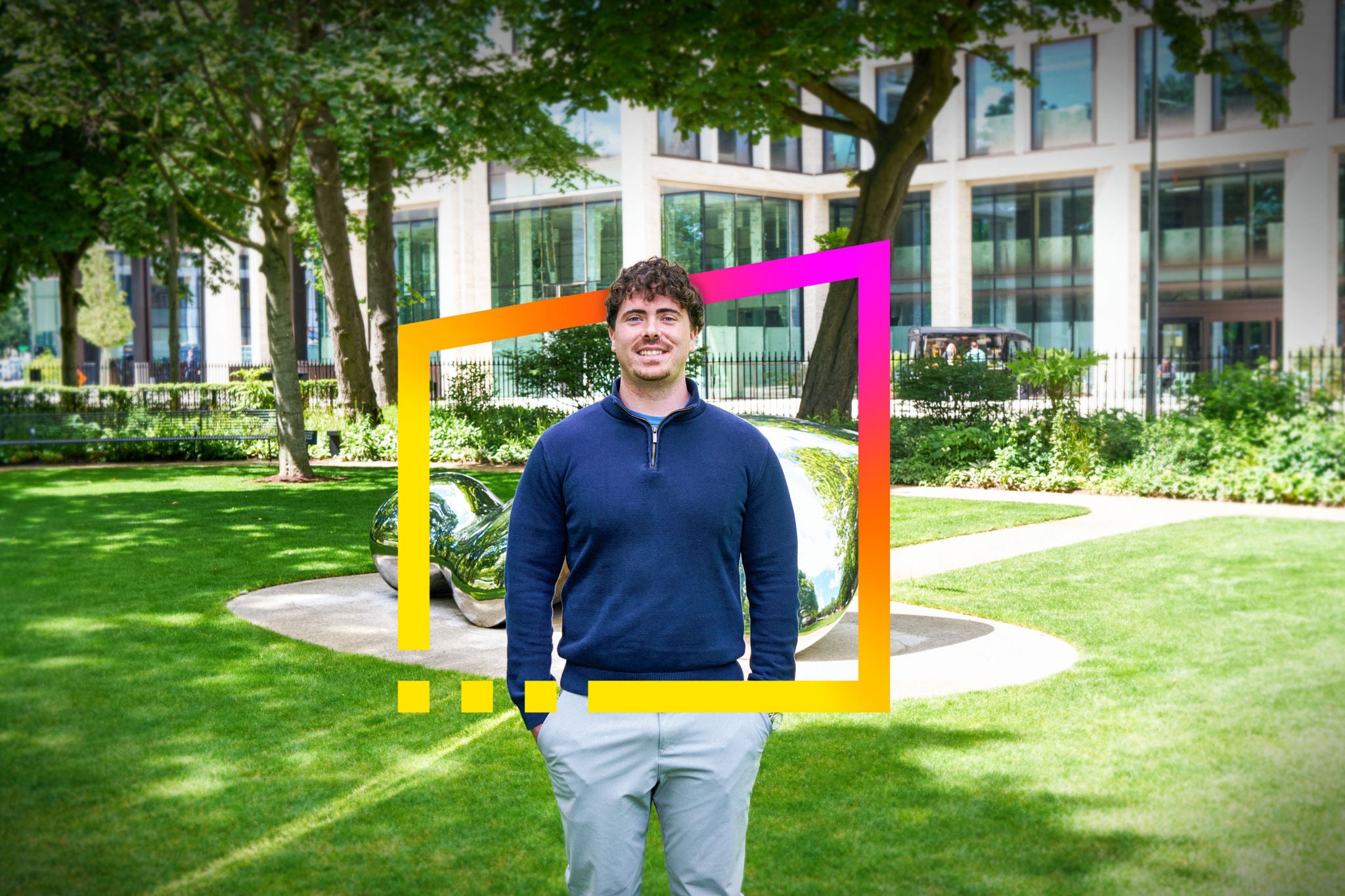 Eoin standing in a landscaped business park with EY brand frame graphic