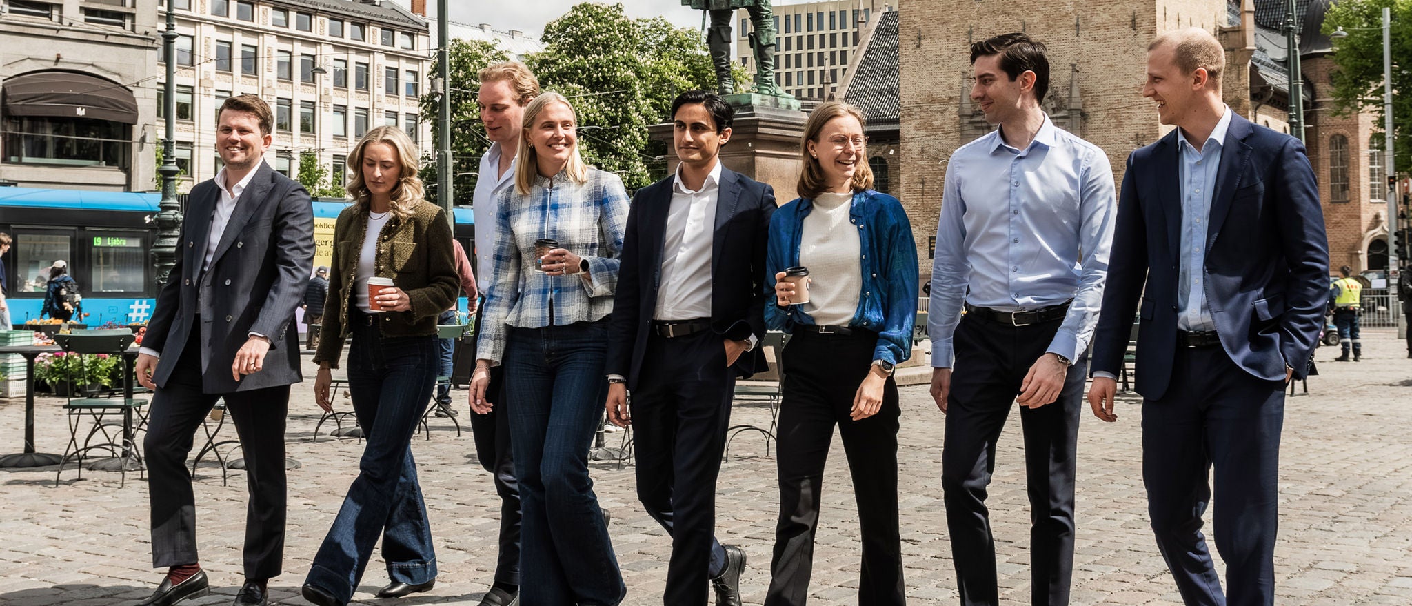 Graduates and early-career professionals networking in the city