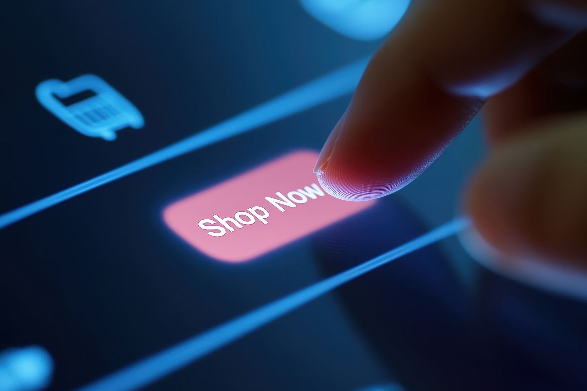 a user's finger hovering over the "Shop Now" button