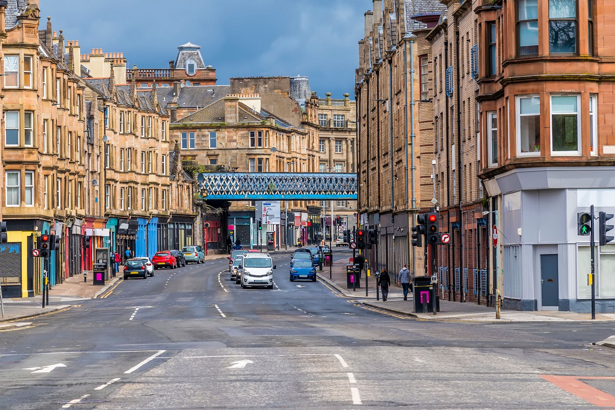 City street lined with vintage shops and historic buildings