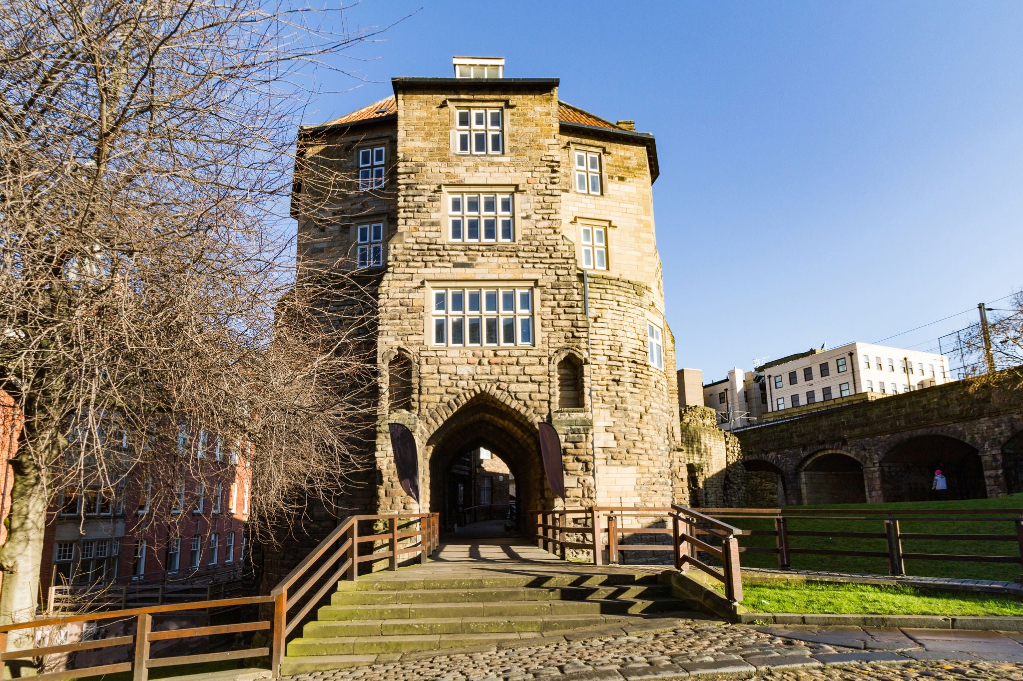 Stone gatehouse with arched entrance and steps