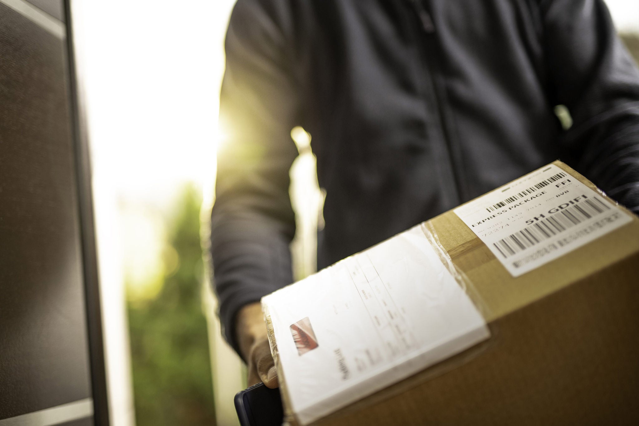 ey-courier-delivering-a-package